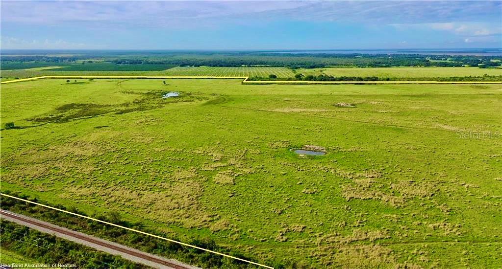 242+-Acre Ranch Lorida Florida Beautiful green bahia pastures fenced and cross fenced with watering ponds, seasonal creek currently leased for cattle with upside potential of multiple unused access road entries could easily be divided into multiple smaller ranches. With Lake Istokopa and the 12 Hours of Sebring/NASCAR Raceway to the west only minutes away and all the growth pushing away from our coastal cities this property has tremendeous upside potential for future development! Proforma metrics: Sod operation at $1,500-$2,200 per acre/ Watermelon farm lease @$250 per acre/ Cattle lease after improving pasture into Hemarthria grass to raise cattle production to 1 cow per two acre after harvesting sod. Hold with highest possible income then when ready to take highest potential profit on sale extend the existing northerly roads into the subject property creating 5-10 acre tracts at $25,000-$30,000 oer acre(Upside Potential) doubling your money/investment!