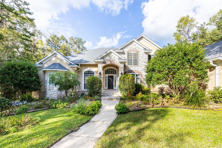 HUGE PRICE IMPROVEMENT!!   This one of a kind 4,419 sq ft home on 1 acre, in the secluded, gated community of Hampton Ridge offers luxurious features and a meticulously maintained design. Built for both comfort and style, the property includes 4 bedrooms, 4 bathrooms, a study, formal living and dining areas, a loft, and a flex room. The grand foyer welcomes you with high ceilings and tray designs, leading to stunning views of the pool and spa. The owner's suite is a private retreat with wood floors, plantation shutters, and a beautifully renovated marble bathroom featuring a glass shower, free-standing modern tub, and modern fixtures.  Every bathroom in the home has been remodeled with modern finishes and fixtures. The spacious kitchen boasts an island, white cabinetry, granite countertops, stainless steel appliances, Wolfe Cooktop, a built-in oven, oversized pantry, and both a wet bar and dry bar, ideal for entertaining. The soaring ceilings in the great room add to the grandeur, while large sliding glass doors open to the pool area, perfect for indoor-outdoor living.  Additional features include ample storage with plenty of walk in closets, a laundry chute from the upstairs suite, and significant updates such as a new roof (2022), a water softener system throughout (2022), resurfaced pool (2017), summer kitchen remodel (2019), a new water heater (2021), and updated AC units within the past 5-7 years. The home is situated near Tioga Town Center, Jonesville, and Haile shopping, offering convenience to nearby amenities.
