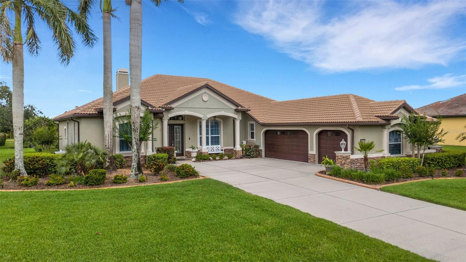 Welcome to this Rye Wilderness Stunner! This Eslinger built home was the model and the extra features prove why. Long driveway leads you to the 3-Car side-entry garage surrounded by lush landscaping and decorative curbing. As you enter through the French Door front entry, you are greeted by the high ceilings, many of which are tray or coffered. A spacious den to the left with hardwood flooring would make a great office or playroom. The living room features a wood burning fireplace and mantel adorned with cracked stone. Dining room offers you that formal space for those intimate dinners or large family gatherings. The kitchen was masterfully planned with center island, under cabinet lighting, tiled backsplash, ample cabinets and counter space and don't forget the amazing views through the aquarium window. A dinette and breakfast bar give you the informal dining space great for entertaining. The primary suite has vaulted ceilings, dual closets, French doors that open to the lanai and plantation shutters. Primary bath includes a garden tub, walk-in shower, water closet, dual sinks, makeup vanity and is separate from the bedroom for added privacy. Two guest bedrooms and guest bath are tucked away on the opposite side of the home for great separation and a pool bath opens to the house and lanai. You will love the outdoor space featuring a heated saltwater pool with sun shelf, hot tub, and an outdoor kitchen. The backyard is very private and has an irrigation system and outdoor lighting. Rye Wilderness is a great neighborhood with larger lots and plenty of space in between homes. You will certainly notice the extras that this home offers that other homes in the community lack. Come see this beautiful property and make it yours today!