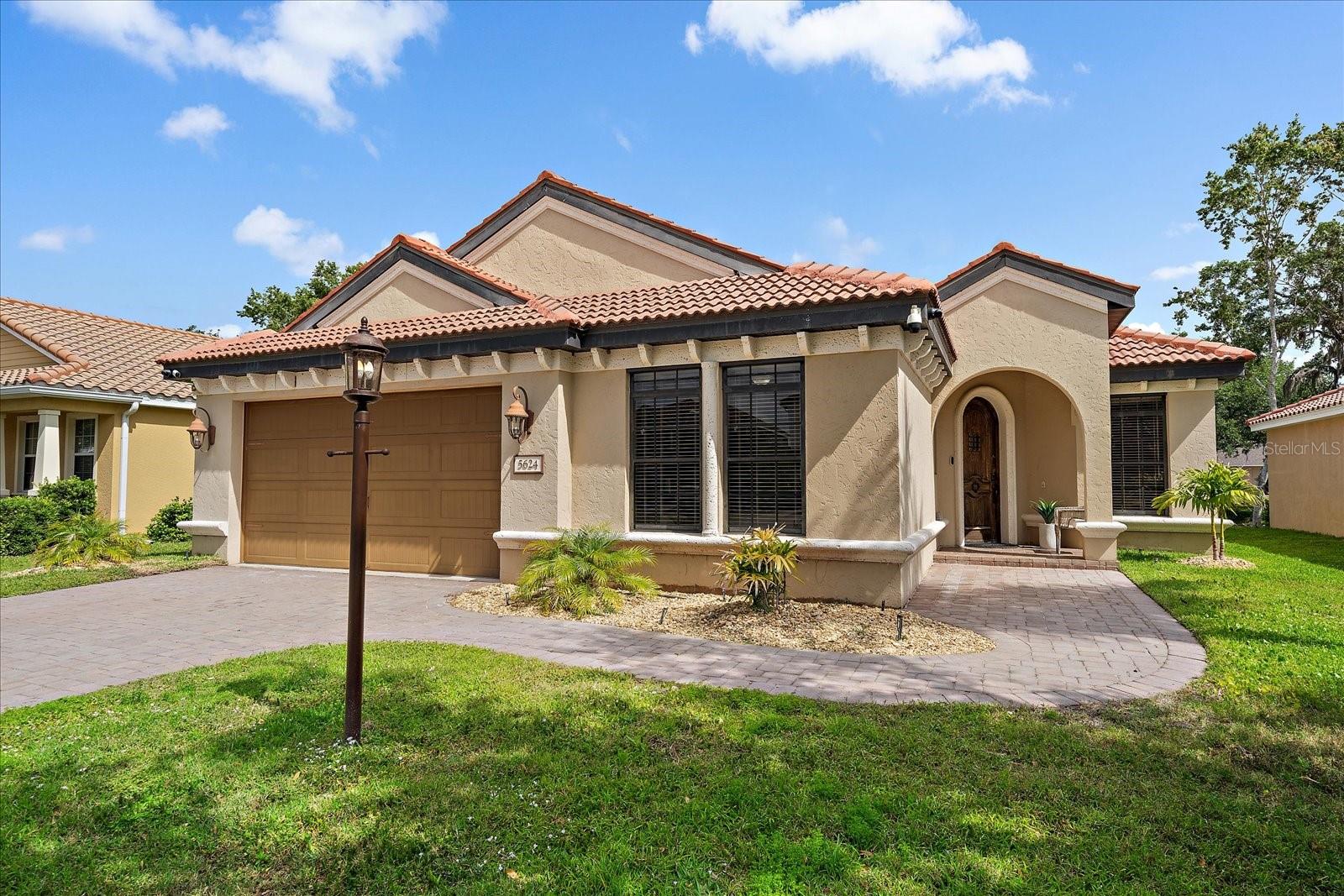 Welcome to 5624 Aaron Ct, a custom-built Sarasota home tucked away on a quiet cul-de-sac, just minutes from shopping, dining, and all the conveniences of I-75 and Bee Ridge. Step inside to soaring ceilings, beautifully detailed tray work, and a seamless flow between the spacious living area and the chef’s kitchen. The heart of the home features warm wood cabinetry, granite counters, and a generous island perfect for gathering — all overlooking a light-filled breakfast nook and inviting family room. The primary suite offers a peaceful retreat with ample space and access to the pool. Outside, the screened lanai and heated saltwater pool with spa create a private escape, complete with a covered outdoor kitchen for year-round entertaining. Major upgrades include a brand-new A/C system (under a 20-year warranty) and a pool heater, both less than a year old. Thoughtfully designed, impeccably maintained, and ideally located — this home delivers on both comfort and style.
