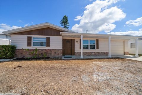 Photo of 3432 Devonshire Drive, Holiday, FL 34691 (MLS # TB8441685) Photo of 3432 Devonshire Drive, Holiday, FL 34691 (MLS # TB8441685)