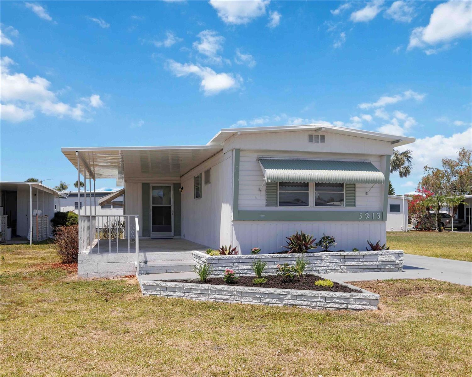 One or more photo(s) has been virtually staged. One or more photos virtually staged- Welcome to this beautifully remodeled 2-bedroom, 2-bath home in the heart of Sarasota’s vibrant 55+ community, Tri-Par Estates—where you own the land and enjoy all the perks of Florida living.
This move-in ready gem has been updated from top to bottom: New roof, fresh interior and exterior paint, new flooring throughout, a completely remodeled kitchen featuring new cabinets, countertops, stainless steel appliances, sink, and lighting. Both bathrooms have been tastefully redone with updated vanities, toilets, mirrors, and fixtures. A new spacious covered carport is on the way with a long tandem driveway fits up to 3 vehicles, and there’s a large storage room with washer/dryer for added convenience.
Enjoy the community’s active lifestyle with access to the heated pool and hot tub, clubhouse, shuffleboard, pickleball, and regular social events like Thirsty Thursdays at the Tiki Hut, coffee mornings, potlucks, and holiday gatherings.
Ideally located near Sarasota’s arts and culture scene, top-rated beaches, marinas, shopping, restaurants, UTC Mall, Benderson Park, hospitals, and I-75. Plus, you’re just minutes from downtown Sarasota, St. Armands Circle, and the Sarasota/Bradenton International Airport.
Whether you’re looking for a year-round residence or a sunny seasonal getaway, this home checks all the boxes. Rentals are allowed—don’t miss your chance to own a piece of paradise!