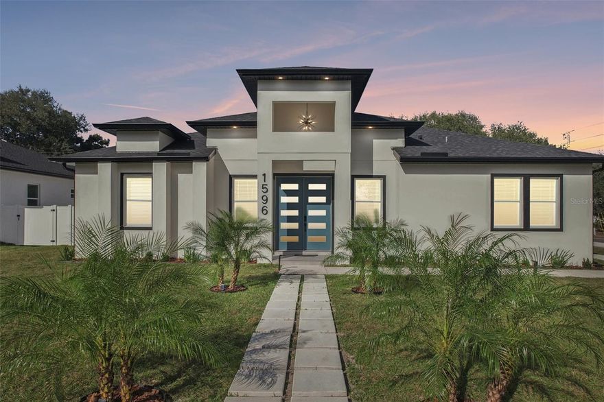 If you are looking for true new-construction luxury in Clearwater, this corner-lot residence at 1596 Nursery Rd is the one to see. This 4 bedroom, 2.5 bathroom home is MOVE IN READY and offers 2,498 square feet of air-conditioned space, solid block construction, and hurricane impact-rated windows and doors for both peace of mind and long-term value.

Every finish and detail is elevated. Large format porcelain tile runs through the main living areas, with soft luxury vinyl in the bedrooms and floor to ceiling tile in all bathrooms. High ceilings and custom millwork give the home a clean, contemporary, upscale feel from the moment you walk in.

The open concept layout centers around a showpiece kitchen designed for both everyday living and entertaining. A massive 16 foot island anchors the space, surrounded by all-wood soft-close cabinetry, quartz countertops, and a luxury appliance package fit for a chef.

The primary suite is a true retreat, with a large walk-in closet and a private en-suite bathroom featuring a double vanity, soaking tub, and an expansive shower and wet area that feels like a world-class spa.

Outside, a private fenced backyard and 2 car garage complete the home. The property sits high and dry in a non-flood zone with no HOA. Luxury new construction of this caliber is rare in Clearwater at this price point. Schedule your private showing of 1596 Nursery Rd today and experience it for yourself.