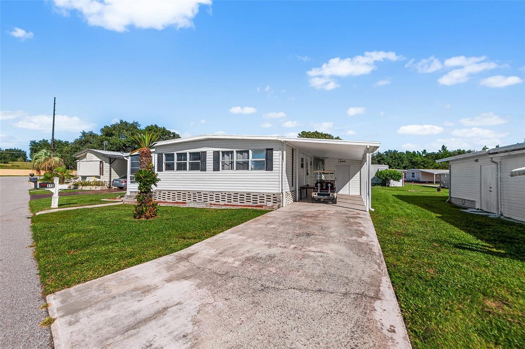 Photo of 115 Cherrywood Drive, Lake Wales, FL 33898 (MLS # L4965314)