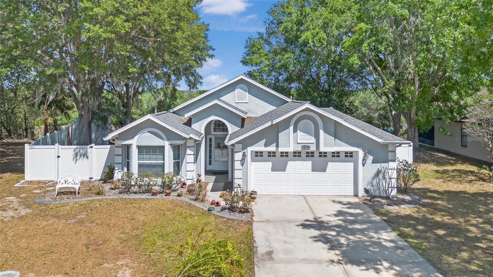 Endless updates await in this charming two-bedroom home with an office that could easily be a third bedroom, located in the sought-after Silver Lake neighborhood of Leesburg. The remodeled kitchen features stylish cabinetry, granite countertops, chic backsplash, and a gas range. The spacious master bedroom offers a walk-in closet, while the master bath includes double vanities and a tiled walk-in shower. Enjoy the convenience of an indoor laundry room with extra storage. The living room boasts newer sliding glass doors leading to a screened-in porch with a ceiling fan. The beautifully landscaped front and backyard include a custom paver patio with a wood-burning fire pit. Fully fenced backyard with no rear neighbors, privacy is guaranteed. Additional updates include newer windows, roof, HVAC, and water heater. Located on a quiet cul-de-sac, this move-in ready home has it all—don't miss out!