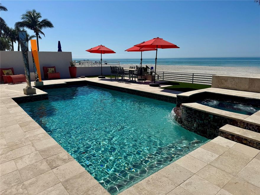 This stunning contemporary beach home is one of a kind head turner with the beach for a back yard! It is one of four unique homes located on the only private driveway in Indian Rocks Beach. The Family, Dining, Kitchen, Master Bedroom and Master Bath all have stunning full beach views. The first floor entrance welcomes you with hand created stained glass double front doors that open to the winding metal and wood floating spiral staircase. The staircases is accented with a curved glass block wall. The sunken Grand Formal Living Area has floor to ceiling glass windows and vaulted ceiling. The 4th bedroom on the lower level has been transformed into a dual office with desks, built-shelving and a walk-in closet. Off of the 4th bedroom is a half bath with a 42 in cabinet, granite top, and stone vessel sink. Formal dining room features a three tiered ceiling with tri-colored neon lighting and the L-shaped serving credenza provides ample storage and serving areas. Moving into the kitchen you will find matching Miele stainless built in convection oven, microwave, warming drawer and cappuccino/coffee system machine. The 5 burner glass top induction stove sits atop granite countertops. Sub Zero side by side refrigerator and Fisher & Paykel dish washing drawers. The seamless stainless steel sink and countertop was fabricated by hand into a single piece of metal. Italian custom made Lube cabinets have under cabinet lighting, hinged glass doors pull-up doors and mini-pulldown garage-door. There is a 3 stool kitchen bar and larger breakfast nook. The wet bar in the breakfast nook has matching granite top above the Scottsman stainless wine refrigerator, mini-fridge and Sub Zero ice maker. The full bathroom off the breakfast nook has glass vessel sink, shower and door that leaves to the beach. The Family room/Media area includes a remote fireplace. It connects to a sunken Family Room with oversized glass sliding door creating the best spot for a awesome sunset viewing nightly. This room also has raised backlit ceiling. The second floor Master Suite has same sliding door leading to breathtaking views from the balcony. The oversized Master includes dual sided fireplace and wrap around built in closets/shelves. Double doors lead into the Master bath that includes split sinks with granite tops, Jet tub below a chandelier and separate shower. (and yes more beach views) A pocket door opens to reveal the Master walk-in closet room. Laundry room has tile floor, cabinets and washer/dryer. 2nd bedroom has attached bath. Granite top sink Bath/shower. There is a long hallway with views of the Grand Formal Living room that will take you to the 4th Bedroom located above the garage. Step down in to the guest room that has walk-in closet and attached bathroom. The newly remolded bath has granite counters and a glass encased shower with custom tile work and river rock flooring. The beautiful pool area has a heated Beadcrete glass beaded pool and spa along with turf for low maintenance. There are stairs that lead from the pool area into the white sands of the beach. Vacation home or full time living, the choice is yours.