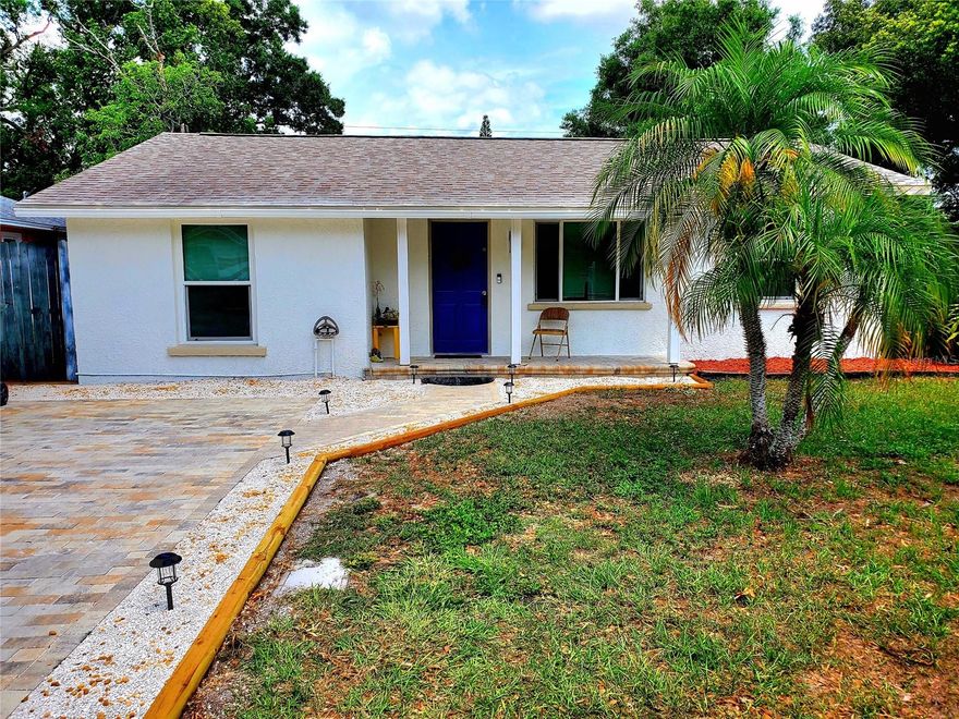 **LARGO SUPER STARTER!** This versatile property is perfect as an investment home (currently tenant-occupied) or as your own residence. The exterior and yard have been completely refreshed, giving the home unbeatable curb appeal for its price range! From the moment you arrive, you’ll notice the freshly painted exterior and brand-new paver driveway. Enjoy relaxing on the covered front porch with its new pavers, ideal for an evening cocktail. Inside, the spacious open floor plan includes a living room, large kitchen, and family room with vaulted ceilings and sliders leading to the back patio. Laminate wood flooring runs throughout the home!  The split-bedroom layout features the primary bedroom on one side and two additional bedrooms on the other. All bedrooms have lighted ceiling fans. The kitchen boasts updated cabinetry, stainless steel appliances, and an adjoining laundry room with a tankless water heater (washer and dryer belong to tenants and do not convey). Out back, a concrete patio overlooks the huge, fully fenced yard—just under a quarter acre—perfect for pets and play. Beautiful Central Park in Largo and Ponce de Leon Elementary is just a short stroll away!  Interior does need a little TLC to make the home perfect!