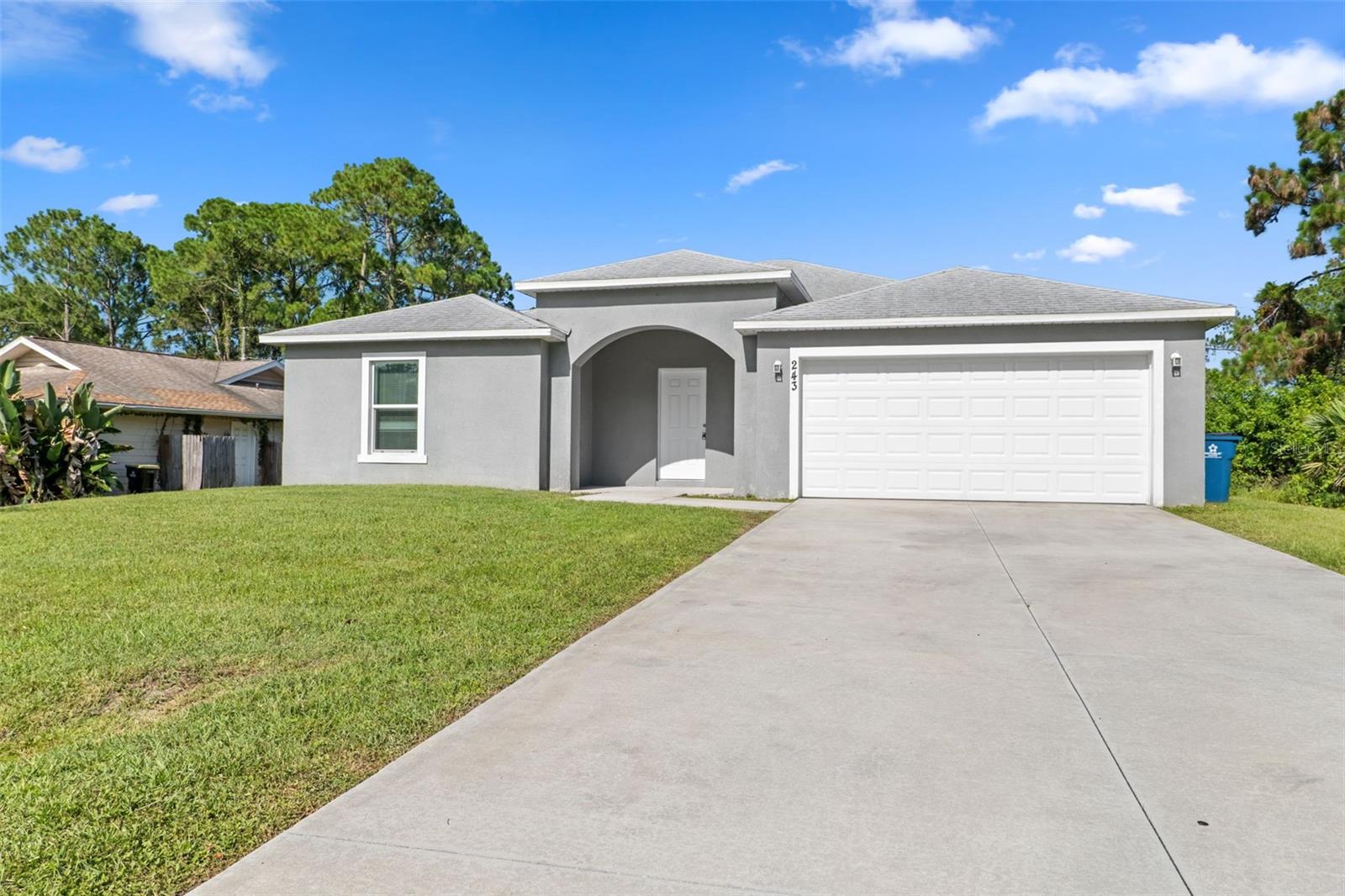 BUILT IN 2021! 4 Bedroom, 2 Bath home with over 1,700 SqFt located in Florida’s Space Coast. This model features an open-concept floor plan with a spacious living area, a modern kitchen, and a dining space. The home includes several upgrades such as granite countertops in the kitchen, stainless steel appliances, and tile flooring throughout for easy maintenance. The split-bedroom layout provides privacy to the primary suite, which boasts a walk-in closet and an en suite bathroom with two sinks and a shower. The remaining bedrooms share a guest bathroom with a bathtub. This property also offers a large backyard with a covered patio, ideal for an outdoor dining or lounge area, BBQ grill, or garden. Its convenient location is just minutes from Malabar Road, public transportation, K-12 schools, and Highway I-95. Less than 30 minutes away from popular attractions like the Brevard Zoo, Indian River, and Melbourne Beach. Submit your offer today!