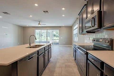 Photo of 4444 Desert Rose Avenue, Kissimmee, FL 34746 (MLS # O6425553)