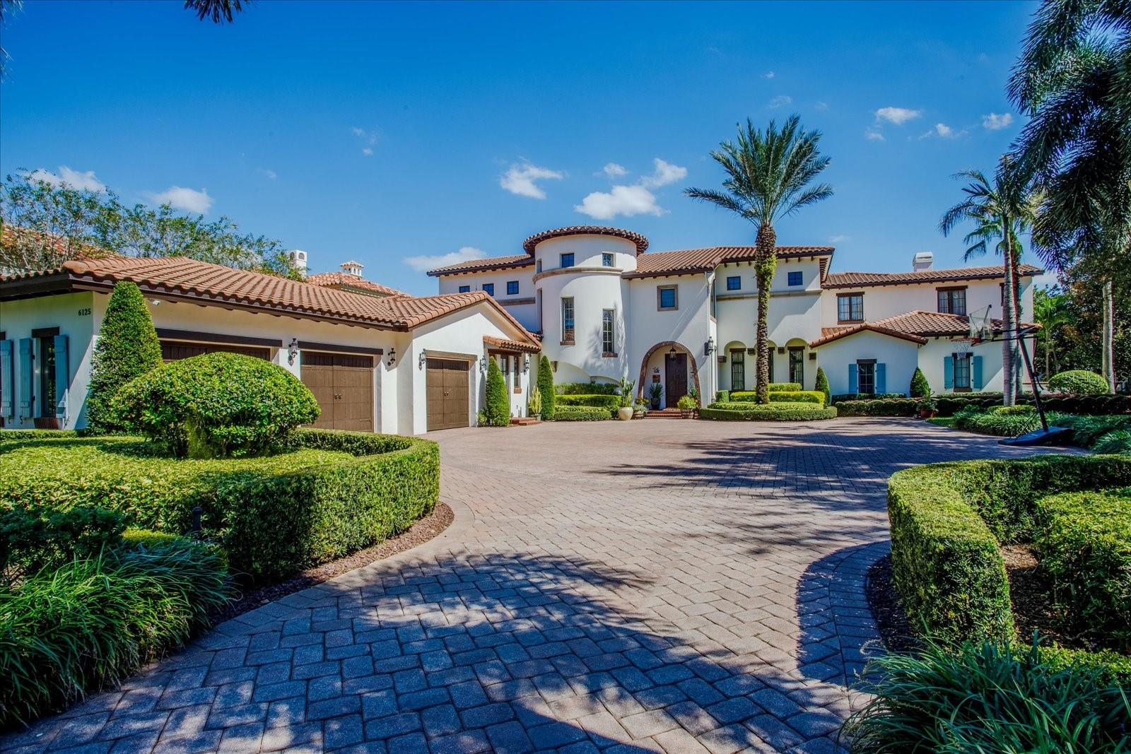 Stunning lakefront home in the highly desired, gated/24 hour guarded community of Keene’s Pointe. This home was thoughtfully built by highly regarded custom home builder Goehring & Morgan. No detail was spared on this private 4-acre estate home located on Lake Tibet Butler of the famed Butler Chain of Lakes. From the moment you enter you are surrounded by elegant finishes, beautifully detailed ceilings and floors and luxurious decor. The functional floor plan offers 6 en-suite bedrooms - two on the first floor and three on the second floor and the first floor primary suite with spacious bath, walk-in closet and its own spiral staircase leading to the upstairs master retreat - currently used as a second closet, it can also be converted back to a library/office/den. Also on the first floor, you will find the formal living/dining room, a kitchen/family room combo, butler's pantry, one of two laundry rooms, a wine cellar and gym. The gym is located off the primary suite corridor and can also be converted to a 4th garage pleasing the car enthusiasts. Both the living and family rooms open up to the stunning covered lanai with fireplace and summer kitchen that leads to the stunning pool area with a beautiful view, gazebo, fire pit, sports court, and your own private dock that gives you access to the lake. The second floor also features a media/game room and spacious balcony, one of the many perfect places to relax and enjoy the lake view. Keene’s Pointe is also home to The Golden Bear Club a membership-only club featuring golf, tennis, fitness, dining and swimming. Among Windermere's best private and public schools and just minutes to shopping, restaurants, and world-famous theme parks!