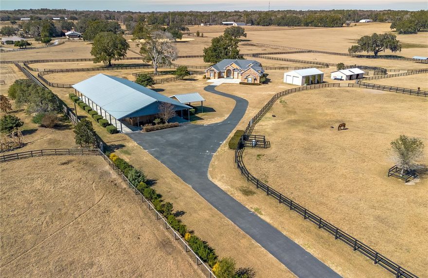 Nestled amongst established horse farms at the heart of Marion County’s Farmland Preservation Area, this turnkey farm provides the perfect blend of flexibility and infrastructure to support a variety of disciplines. Fenced and gated on nearly 20-acres of countryside, land is beautifully open with – an ideal environment for those looking to train year-round. A total of seven paddocks are in place, each featuring gentle shade from mature trees, 3-board fencing, and automatic waterers. The 15-stall barn is designed for functionality, with a shed-row layout, tack room, feed room, covered wash rack, and office / barn apartment. Additional outbuildings provide additional storage space for vehicles, large equipment, trailers, while an RV hookup adds the option for visiting trainers or seasonal rental income. Partial B2 zoning provides valuable flexibility, allowing for the potential development of an agriculture-related business in addition to traditional farm use. At the heart of the property is the custom 4-bedroom, 4-bath home which provides over 3,100 sqft of space and stunning views of the surrounding farm. Light and bright, the home features a split-bedroom floor plan with high ceilings, tasteful paint choices, and lots of space. The kitchen is well-appointed for those who enjoy cooking with stainless steel appliances, ample cabinet and counter space, center island, additional pantry storage, breakfast bar, and adjacent breakfast nook with mitered windows overlooking the pool area. A gas fireplace serves as the focal point of the family room, which is directly open to the kitchen for added comfort and entertaining ease. The primary bedroom is a true retreat that features stunning natural light from bay windows, dual walk-in closets, and a private-ensuite with walk-in shower, garden tub, dual vanities, and heated tile floors. Additional spaces to note in the home are the formal dining area  and living room adjacent to the foyer, an oversized attached garage, and a full laundry room with built-in cabinetry and sink. Off of the laundry room is a staircase leading up to the second floor, which offers a full secondary suite with walk-in closet and full bathroom. This is an ideal option for long-term guests, in-laws, or use as a private office if desired. Those looking to enjoy the year-round warm weather will love the large covered patio at the back of the home, which overlooks a sparkling in-ground pool with large pool deck and safety fencing. Located just a short drive from multiple local show venues including Majestic Oaks, Sweet Dixie South, HITS, and the World Equestrian Center (WEC), this property is an ideal option for those looking to enjoy everything horse country has to offer. Offering space, location, and proven farm functionality, this is an exceptional opportunity to own a versatile horse property in one of the country’s most sought-after equestrian regions!