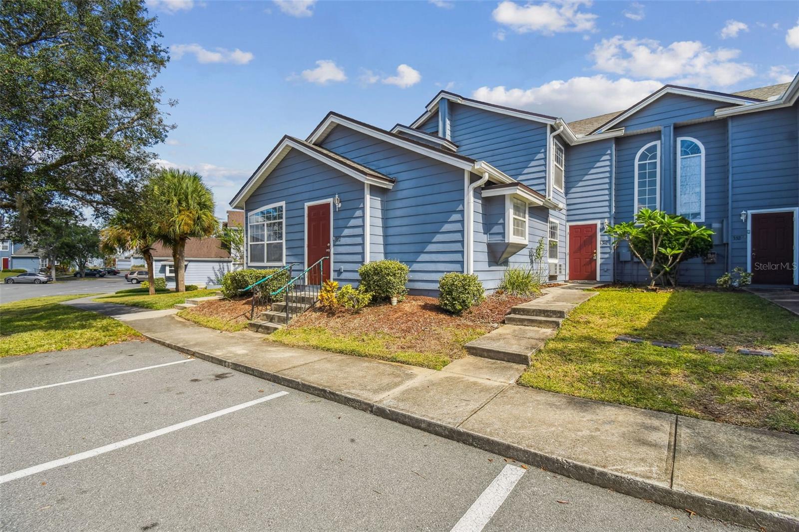 Welcome to this beautiful move-in-ready 4-bedroom, 3-bathroom townhouse offering a perfect combination of comfort, functionality, and investment potential. A unique highlight of this home is the first-floor bedroom with a private secondary entrance, providing flexible options for use as a multi-generational living space, private guest, or potential rental opportunity. Located in the desirable Island Club Resort, residents enjoy access to exceptional amenities, including a clubhouse, resort-style pool and sauna, basketball and tennis courts, beach volleyball area, and a fully equipped fitness center. Conveniently situated just minutes from major medical facilities, restaurants, shopping, and approximately 15 minutes from the Disney area, this property offers an outstanding lifestyle opportunity. Whether you’re seeking a primary residence, investment property, or vacation retreat, this home offers versatility and value. Recent upgrades include new flooring, updated countertops in the kitchen and bathrooms, and new appliances