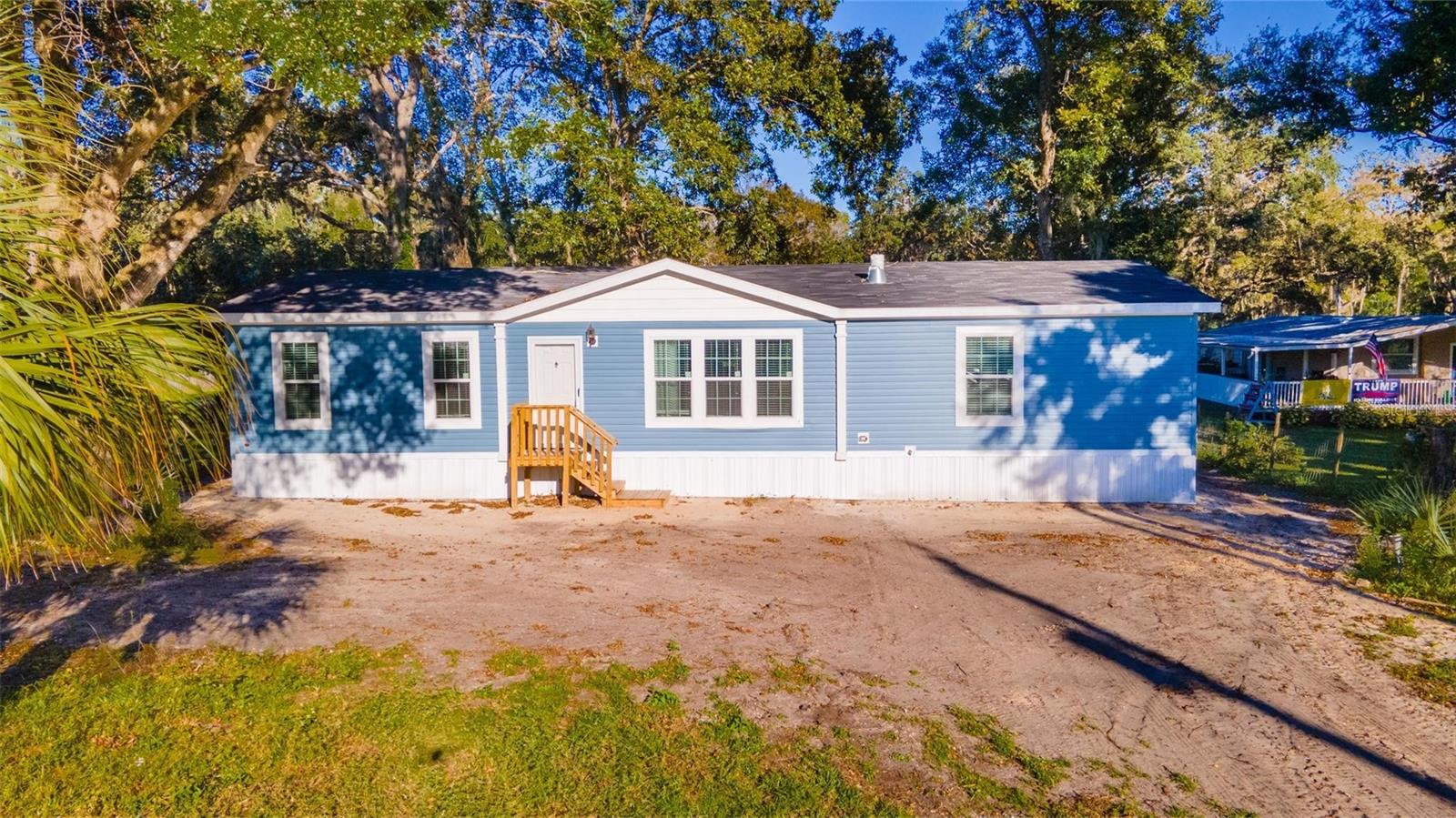 Beautiful and Brand New - never been lived in - manufactured home on over 1 acre with easy access to US1 and just minutes away from River Breeze Park. Open floor plan on this double wide with an expanded 2ft from original plan. Kitchen features coffered ceiling detail with pendant lights over the breakfast bar, white cabinetry with plenty of storage, unique windows to bring in extra light and see into the backyard. Living room features stone built in wood burning fireplace with built in shelving on each side. Laundry is just off the kitchen providing extra storage and exit to the back yard. Primary bedroom with spacious walk in closet has en-suite bathroom. Walk in shower with dual shower heads, bench and glass enclosure, soaker tub and double vanities with makeup counter. Guest bedrooms on opposite side of the home each with their own walk in closet. Large storage shed in the back yard. Plenty of room on the property for your enjoyment.