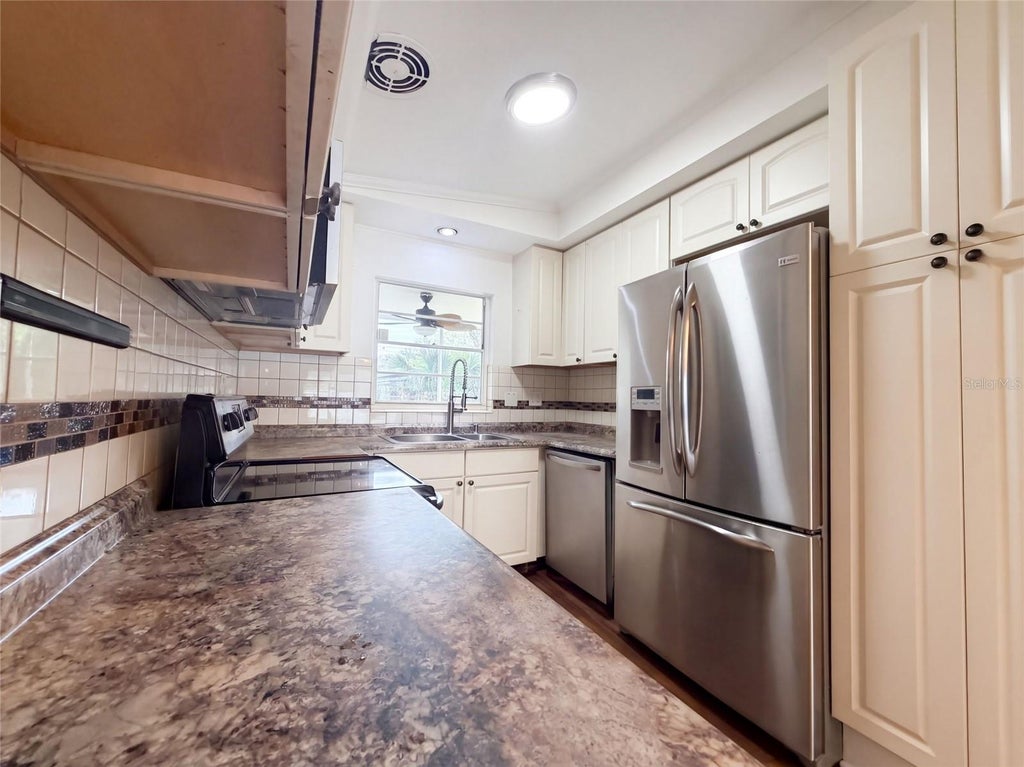 Photo of 409 Berwick Avenue, Temple Terrace, FL 33617 (MLS # O6448360)