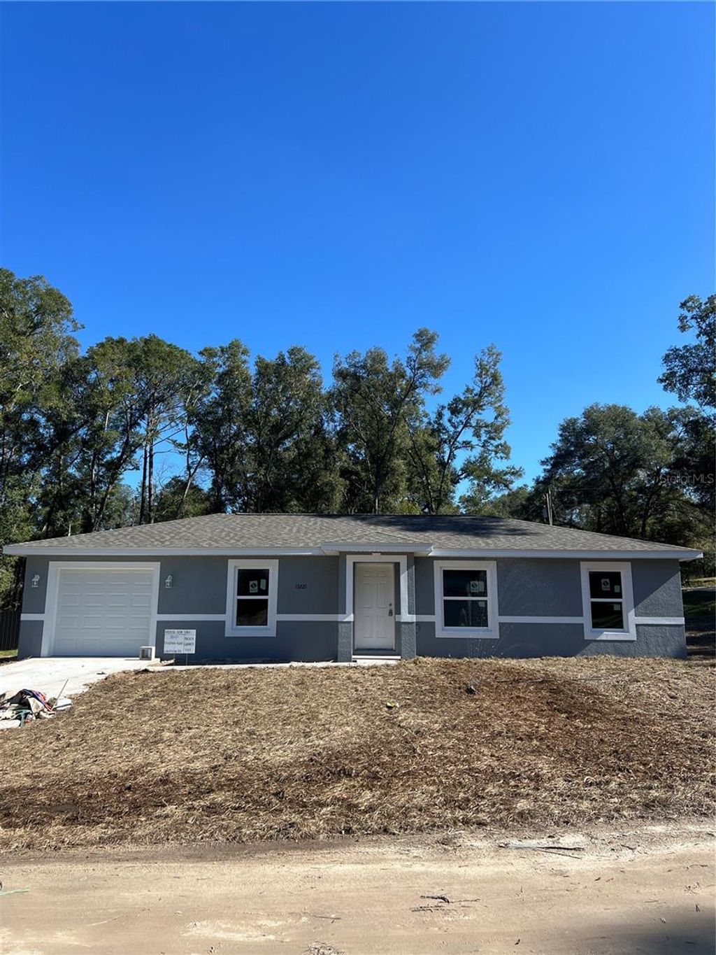 Photo of 13221 SE 41st Terrace, Belleview, FL 34420 (MLS # OM715595)