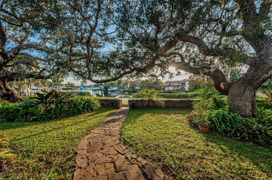 Welcome to 330 N Spring Blvd, a rare opportunity to enjoy direct bayou frontage with a private dock just moments from Tarpon Springs’ historic downtown. Set on a lush half-acre lot, this exceptional home offers tons of Old Florida charm paired with an authentic Florida boating lifestyle.
Spanning 2,300+ square feet, the home features a thoughtful layout filled with character and warmth. Off the living room, a charming breezeway is perfect for your morning coffee or a quiet read and provides easy access to the spacious front patio, an ideal spot for unwinding, entertaining, or simply enjoying the peaceful surroundings.
The spacious kitchen is a chef’s dream with abundant cabinet and counter space, perfect for hosting family and friends. The private owner’s retreat features a stunning spa-style bath with a walk-in shower and rain showerheads, creating a relaxing sanctuary.
A split floor plan leads to generous secondary bedrooms along with additional space ideal for a home office or craft room. Recent improvements include a newer roof, new AC system, and updated ductwork, offering comfort and peace of mind.
Bring your boats and water toys and enjoy the private dock with access to Spring Bayou, the Anclote River, and the Gulf of Mexico. This truly special property delivers space, waterfront living, and unbeatable proximity to downtown shops, dining, events, and waterfront parks.
Don’t miss this Tarpon Springs gem—schedule your private showing today.