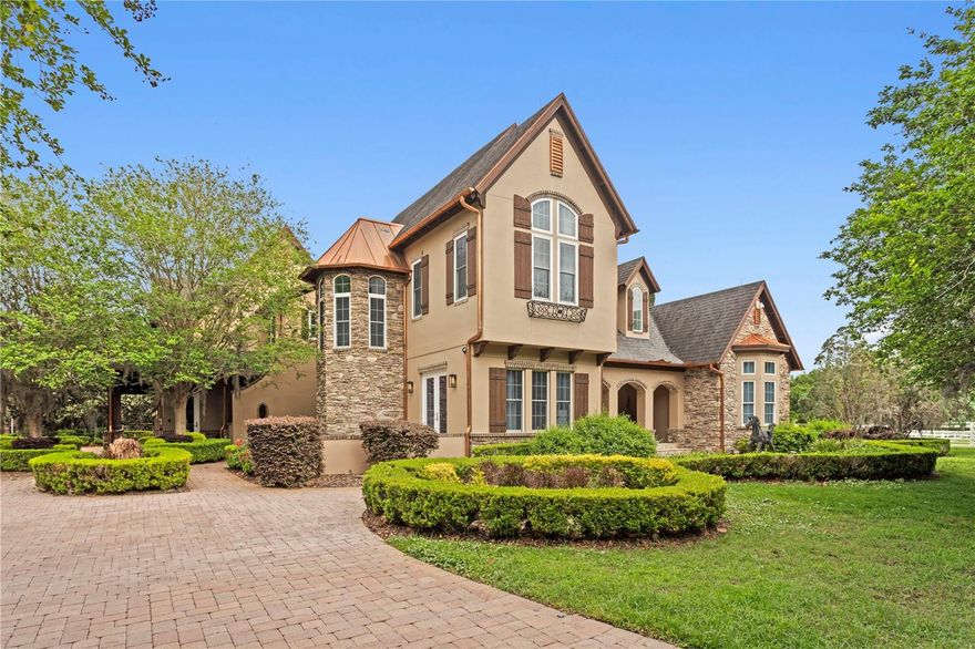 Welcome to an extraordinary estate nestled within the exclusive gated equestrian community of Citrus Green, where luxury living meets world-class equestrian design.

Spanning nearly 11,900 square feet under roof, this 4-bedroom, 5.5-bath residence is thoughtfully curated with high-end finishes and intentional spaces throughout. A striking stone fireplace anchors the main living space, creating a warm yet sophisticated focal point for gathering and entertaining. The gourmet chef’s kitchen seamlessly blends elegance and function, while the luxurious primary suite offers a private retreat designed for comfort and indulgence.

A private theater, thoughtfully converted from a guest suite, offers the flexibility to be restored if desired. This elevated entertainment space features its own full bath, wet bar, and beverage cooler, delivering a true cinematic experience within the comfort of home. Every bathroom has been beautifully remodeled, and a former main-level office has been transformed into a one-of-a-kind designer shoe gallery.

Step outside to your private resort-style oasis featuring a saltwater pool and spa, a fully equipped outdoor kitchen, and multiple entertaining areas surrounded by lush landscaping and over 120 LED landscape lights. A cozy front fire pit and a custom basketball court add to the lifestyle appeal.

Car enthusiasts and hobbyists will appreciate the 3-car attached garage plus an impressive detached 7-car garage/workshop with five 12-foot doors, perfectly suited for RVs, horse trailers, or recreational storage.

For the equestrian enthusiast, this property is truly unmatched. The state-of-the-art 9-stall barn is outfitted with upscale finishes including chandeliers, Rockin’ J stalls with drop yokes and brass finials, removable panels for foaling, and premium airflow with oversized fans and LED lighting. The barn also features an automatic watering system, pest control system, composite rubber flooring, indoor wash rack, and air-conditioned tack and feed rooms.

Above the barn, a well-appointed groom’s quarters offers a full kitchen, dining area, bathroom, and custom walk-in closet, providing both comfort and convenience. Additional amenities include a laundry area and full bath within the stable.

Train and ride year-round with a covered, fully lit 80’ x 150’ arena with professional-grade footing, plus a 60-foot round pen. The entire property, spanning over 7.63 acres, is fully irrigated and thoughtfully divided into five lush pastures with classic four-board white fencing.

Rounding out this exceptional estate is a private golf green with 20- and 30-yard tee boxes, mature trees, manicured grounds, and a private gated entrance that ensures both security and exclusivity.

This is more than a home, it’s a lifestyle tailored for those who expect the very best in luxury and equestrian living.