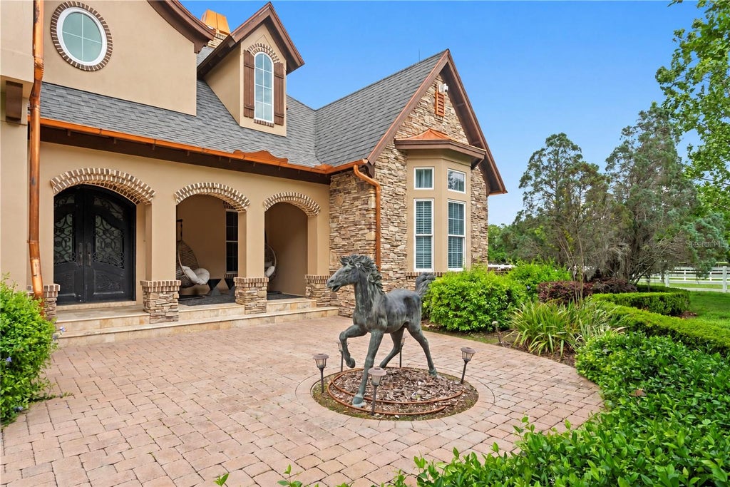 Photo of 11410 Trotting Down Drive, Odessa, FL 33556 (MLS # TB8498512)