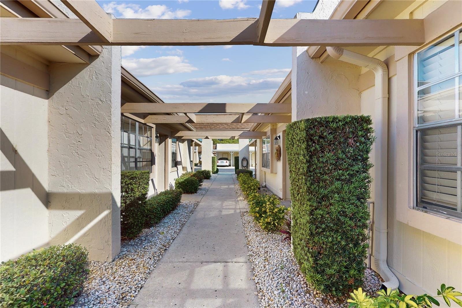 Nestled in the heart of Timber Oaks – Fairway Villas, this meticulously maintained and fully furnished 2-bedroom, 2-bath condo offers the perfect blend of comfort, style, and low-maintenance living within a vibrant 55+ community.
Designed for ease of living, the interior features ceramic tile flooring throughout, enhancing both style and durability. The kitchen includes ample cabinetry and countertop space, with a layout that ensures functionality and separation from the main living area.
The primary suite offers a spacious bedroom, ample closet storage, and a private en-suite bath with a walk-in shower. A stackable washer and dryer is also included within the unit for added convenience.
Relax and unwind in the screened-in lanai, an ideal setting for morning coffee or quiet evenings. Additional highlights include covered carport parking and a dedicated storage closet just steps from the unit.
This residence is being sold fully furnished, offering a turnkey opportunity for seasonal or year-round living.
Community amenities include two swimming pools, a spa, tennis courts, clubhouse, fitness center, billiards, a library, and more. Monthly fees include cable TV, internet, water, sewer, trash, exterior maintenance, and building insurance.
Conveniently located near shopping, dining, medical facilities, and US-19, this home provides a comfortable and connected lifestyle in one of Pasco County’s most established 55+ communities.