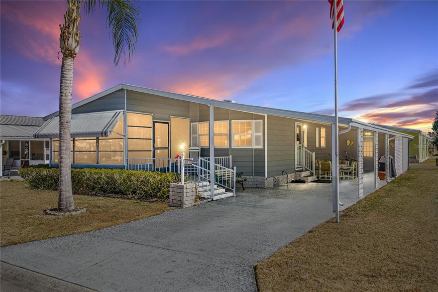 Welcome to a rare find in Colony Hills, an amenity filled 55+ community where you own the land. This spacious 2 bedroom, 2 bath home has a dedicated office, a built in speaker system, and updates that provide peace of mind including a 2019 roof, 2023 AC, 2023 water heater, and an added bonus- this home is offered furnished! Arrive to a freshly painted 2024 exterior, a roomy 2-car carport, a welcoming covered patio, a bonus storage room, and an enclosed front Florida Room, an easy spot to enjoy morning coffee and friendly chats with neighbors. Inside, the expansive 18x12 living room connects effortlessly to the Florida Room through sliding glass doors on one end, and opens to the dining room and kitchen for a comfortable, natural flow on the other. The eat-in kitchen is ideal for hosting, complete with laminate flooring, a newer dishwasher and microwave, a built-in oven, a cooktop, and a stainless steel refrigerator. It overlooks the generous dining area, enhanced by built-in storage, a serving counter, chair rail molding, and charming decorative molding that continues down the hallway. A fun surprise awaits there too- a built-in speaker system that plays music throughout the living room and both bedrooms! The dedicated office is a standout feature in this community and includes plush carpeting, a ceiling fan, and a built-in desk, perfect for work, crafts, or a quiet reading nook. The primary bedroom sits peacefully at the rear of the home and offers a walk-in closet, generous sleeping space, and an ensuite bathroom with an updated vanity and walk-in shower. Even better, the laundry is right here, and the washer and dryer stay! The second bedroom also includes a walk-in closet and sits near the home’s second full bathroom with a tub/shower combo. All of this comes in an unbeatable location, close to Zephyrhills shopping, entertainment, and restaurants, with an easy drive into Wesley Chapel or to major highways. Colony Hills residents enjoy a vibrant lifestyle with an active clubhouse, swimming pool, spa, shuffleboard, and tennis courts. Come see this exceptional home for yourself, call us today!