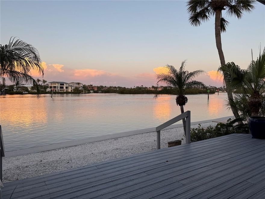 A rare bayfront opportunity to create your dream retreat in Polynesian Gardens on Siesta Key. Experience the allure of waterfront living in this rarely available detached bayfront villa, poised for a fresh vision in the desirable Polynesian Gardens community on Siesta Key. One of only 11 exclusive bayfront residences, this end-unit villa offers sweeping, unobstructed views of the Intracoastal Waterway from nearly every room, where sunrises paint the sky in breathtaking hues. Go outside to your expansive private waterfront deck, where you can unwind to the sights of boats gliding by, playful dolphins in the distance and the peaceful rhythm of the bay. A natural beachfront at your doorstep invites you to dip your toes in the water and embrace the tranquil coastal lifestyle. Professionally remediated following Hurricane Helene, this residence is now a blank canvas, ready for transformation. With a spacious two-bedroom, two-bath layout that exceeds the size of many three-bedroom villas in the community, the potential for a luxurious, customized retreat is limitless. Enjoy the privacy and convenience of your own garage and private entrance, delivering the feel of a single-family home, yet with the ease of villa living. The location is unbeatable, just minutes from the world-famous Siesta Beach, renowned for its soft quartz sands and mesmerizing Gulf waters, where mango-hued sunsets cap off each day. Centrally located on the island, you're moments from the vibrant dining, boutique shopping, and lively atmosphere of Siesta Key Village and South Siesta Village, and just a short drive to downtown Sarasota’s cultural arts scene, theaters and fabulous dining. This is a rare opportunity to reimagine and create your custom bayfront sanctuary in one of Siesta Key’s sought-after communities. Don’t let this one-of-a-kind coastal gem slip away.