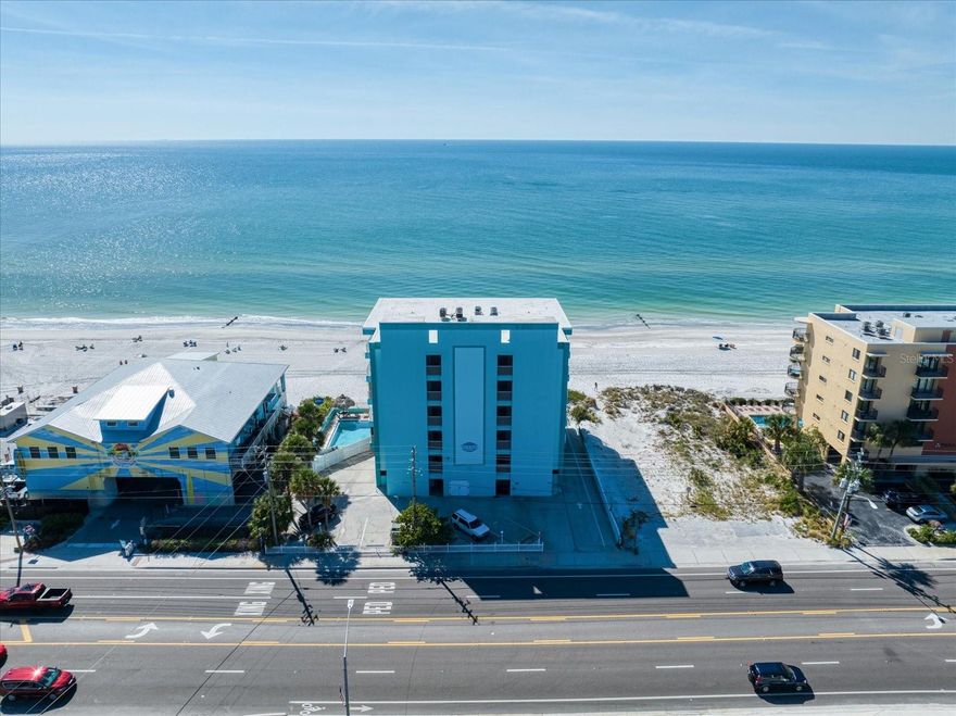 WATERFRONT/BEACHFRONT-MADEIRA BEACH-GULF OF MEXICO-this TURN KEY 3/2 CONDO is directly on the Gulf coast’s renowned shoreline! Welcome to ARENA DE MADEIRA a Condominium Community with sand on your feet beach access. Experience coastal living at its finest in this fully furnished down to the glassware, 3-bed, 2-bath 2nd floor residence. Enjoy morning walks on the oceans immaculate sand beaches, breathtaking sunset views from your back & side wrap-around covered balconies, spotting dolphins and relishing the private beachfront pool. This 2nd-floor end unit offers ocean views to the west, south, and north. Fully furnished with all appliances, towels, bedding, and TVs – just pack your suitcase! Ideal for year-round living, a winter retreat, or a lucrative investment property (14-day rentals allowed, the current owner enjoying over $70k in annual profit & resided personally 3 winter months). Inside, find generously sized bedrooms, a master en-suite, and 2 fully renovated bathrooms. The updates by seller include renovated kitchen 2017 w stainless steel appliances & stone counters, a Samsung front-load washer-dryer, NEW HURRICAINE GRADE DBL PANE WINDOWS & SLIDING GLASS DOORS through out unit ($35k )offering peace of mind , new interior paint just finished (11/23), AC (2019), and water heater (2020). Community amenities include secured elevator access, under-building reserved parking, and ample guest spots. Cable, internet, water-sewer, trash, maintenance, building insurance, condo manager, beachfront pool, storage, and grounds maintenance. This condo runs itself! With immediate residency possibilities, this condo is an opportunity to own a piece of paradise – whether as your permanent home, a wise investment, or a winter escape. Call for a private showing today and make the sand beneath your feet a daily reality!