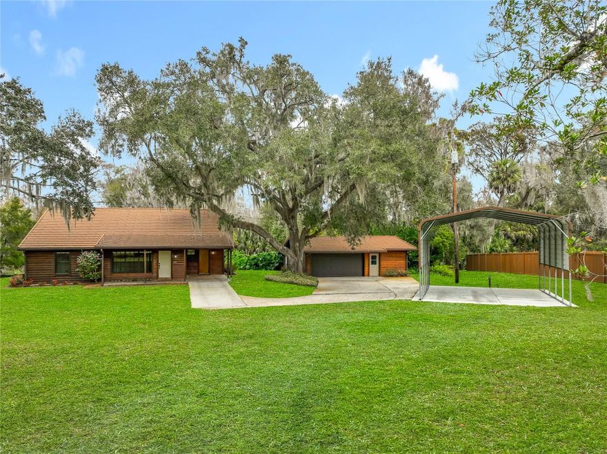 PRICED REDUCED TO SELL! A TRULY RARE Find!!!  Welcome to the LIFESTYLE of this WEKIVA RIVER FRONT RETREAT!   ***Flowing from the Wekiva Springs, it is Known as One of the MOST PRISTINE RIVERS IN the State of FLORIDA!  ***VIRTUAL TOUR 1 is a SNEAK PEAK OF THE WEKIVA RIVER LIFESTYLE**     **Nestled on a Secluded, Private Gate  ***PREMIUM 2.68 acres with OVER150ft Wekiva River front, you will Experience Tranquility & Privacy while still having the Convenience to all that Central Florida has to offers.  From the  ** the LARGE 32.5 x 13 DECK**, the  **COZY FLORIDA ROOM**, the *Oversized Great Room, and the Primary Bedroom room, **NATURE ABOUNDS with ***BEAUTIFUL RELAXING VIEWS of **CONSERVATION AND FOREST areas.  **The OPEN & LUSH MATURE Landscaping will draw you to the banks of the awaiting SPRING-FED WEKIVA RIVER**.  ** Looking to be more Active?  From the large deck, you are just steps away to  your own private CANAL leading to the beautiful Flowing River.  This makes this property a paradise for Kayaking, canoeing, paddleboarding, fishing and of course boating on the Wekiva River which is also only 4 miles by boat from the Historic St JOHNS RIVER. You may even be able to build a dock with proper permits! ***Recreation and Relaxation is what this Riverfront property is all about and to prove that there's even an amazing extra Large RV Carport (20ft w x 25ft l x 14ft h - with 30amp power) to Protect your favorite RV, Car, or Boat.  ***For the active land lovers… you can enjoy Walking, Hiking, Biking, Gardening or Creating that special project in the Oversized WORKSHOP in the garage.   
MORE PERKS…  With its rustic exterior yet OPEN CONCEPT LIVING and HIGH CEILINGS, this 3-bedroom SPLIT PLAN, 2-bathroom, 2078sf home is MOVE-IN READY with NO HOA.  The IMPRESSIVE 33 x 20 Great Room will quickly become one of your favorite areas with its HIGH CEILINGS, LARGE WINDOWS and BREATHTAKING VIEWS.  Warm up to the WOOD-BURNING FIREPLACE Surrounded by a BEAUTIFUL NATURAL STONE WALL with Hearth and Mantle.  Enjoy having your morning coffee, read your favorite book, relaxing game time with family and friends, or an evening watching the SUNSET from the Perfectly Appointed yet COZY FLORIDA ROOM.  Perfect for Entertaining, everyone will Love Gathering around the Kitchen and Breakfast bar with its OPENESS to the Great room and Dining area.  You will also love the convenience of the kitchen’s custom pull-out drawers.  The Large Primary Bedroom with HIGH CEILING, WALK-IN CLOSET, & FRENCH DOORS leading out to the deck with its own AMAZING VIEW makes it a true Nature SANCTUARY!  Speaking of Nature, occasional visits from families of Deer, Turkeys, a variety of wildlife are a welcoming treat to watch.  **The 19 x 14 Living room with its extra-large window invites Natural Light to flow in as well as giving you a wonderful PANORAMIC VIEW of the beautiful front Landscaping which includes stunning Azaleas, Magnolias, and more.  Third bedroom is already set-up to use as a gym but could easily be a great home office too.  Besides the fact that this is such a RARE FIND on the Wekiva River front, this is also a real estate dream with its LOCATION, LOCATION, LOCATION !  Secluded but also Convenient to Grocery Stores, Restaurants, Shopping, Entertainment and local airports with highways CR46; SR429; I-4 & SR417 all within minutes from your front gate.  Schedule your private showing today.  Note: Property may be under audio video surveillance for security.