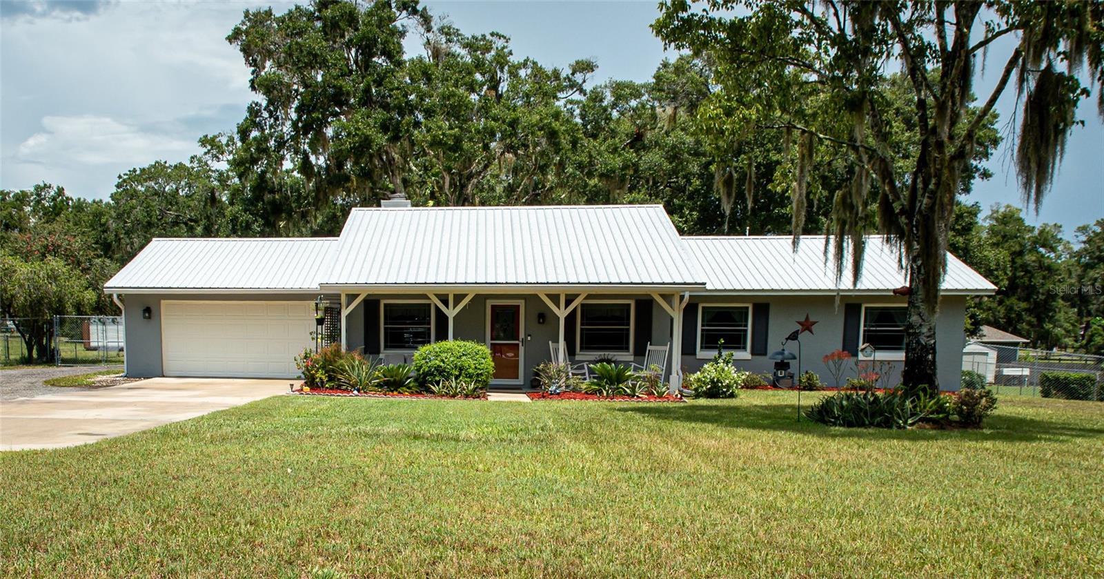 Move-In Ready Modern Ranch on 1.21 Acres with Workshop!
Welcome to this beautifully renovated 3-bedroom, 2.5-bath home, offering 1,650 square feet of stylish, practically new living space on a spacious 1.21-acre lot. Nearly every feature of this home has been thoughtfully updated—including the roof, gutters, lighting, windows, doors, kitchen, bathrooms, flooring, and landscaping—making it truly move-in ready.
Enjoy an open and airy layout, perfect for both everyday comfort and entertaining. Step outside to your expansive yard, surrounded by new fencing, with plenty of room to relax, garden, or play. Car enthusiasts, hobbyists, or business owners will love the impressive 24x40 metal building and additional shed for storage or workspace and chicken coop.
Modern conveniences include an EV charger, generator plug, and a two-car garage. The new drain field and fresh landscaping complete the package for easy, worry-free living.
This is country living with all the modern touches—don’t miss your chance to own this upgraded gem! Only minutes to Downtown Deland with many options for dining, healthcare and entertainment. Home of Stetson University and the Athens Theatre.