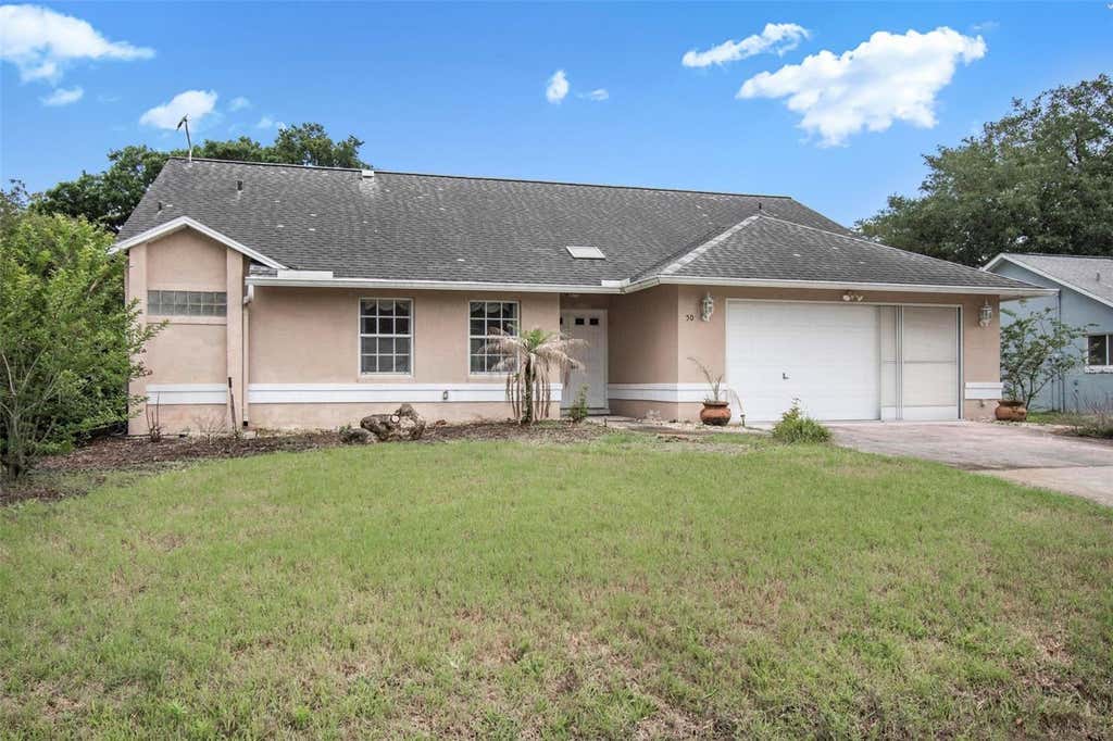 Photo of 50 Westover Drive, Palm Coast, FL 32164 (MLS # FC318479)