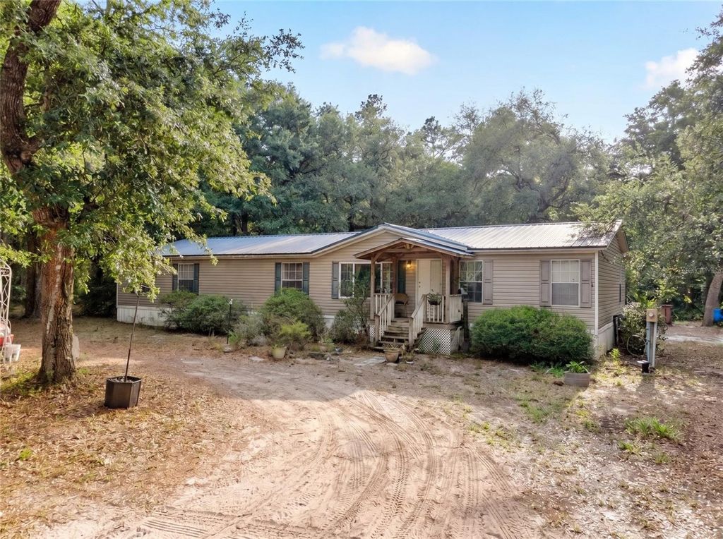 Photo of 9190 NE 144th Terrace, Silver Springs, FL 34488 (MLS # OM723584)