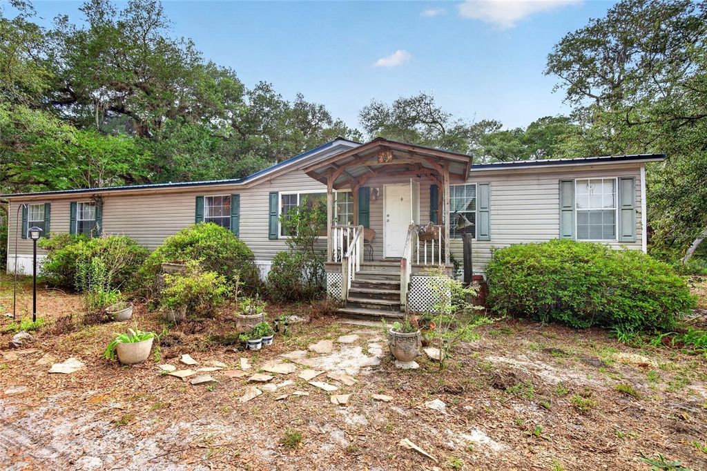 Photo of 9190 NE 144th Terrace, Silver Springs, FL 34488 (MLS # OM723584)