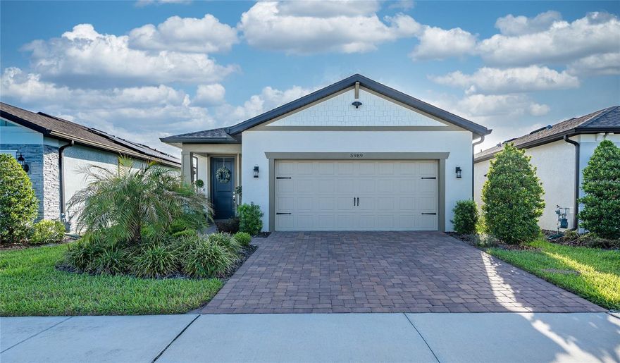 Welcome to the highly sought-after 55+ community of Del Webb Bexley, where RESORT STYLE LIVING meets comfort, convenience, and peace of mind. From the start, you’ll appreciate the incredible value of an HOA that includes CABLE, INTERNET, AND LAWN MAINTENANCE—freeing you from everyday upkeep and giving you more time to enjoy the lifestyle you’ve been waiting for. Even more iIMPRESSIVE, this home is equipped with MOTORIZED HURRICANE SHUTTERS ON THE LANAI and HURRICANE SCREENS ON EVERY WINDOW, providing strong, convenient protection and added security so you can feel confident and prepared year-round. This popular Hallmark floorplan offers 1,640 square feet of thoughtfully designed living space that feels open and inviting the moment you step inside. The home is IMMACULATELY MAINTAINED and features LUXURY VINYL FLOORING throughout—NO CARPET ANYWHERE—creating a clean, modern look that is both durable and easy to maintain. PLANTATION SHUTTERS THROUGHOUT add timeless elegance while allowing you to easily control light and privacy. The KITCHEN is both stylish and functional with beautiful QUARTZ COUNTERTOPS and ample workspace, with matching QUARTZ surfaces continuing into both the PRIMARY and GUEST BATHROOMS for a cohesive, upscale feel. The Primary Bedroom WALK-IN CLOSET includes CUSTOM WOOD SHELVING as well as the PANTRY which is also outfitted with WOOD BUILT IN SHELVING, making organization effortless. EIGHT FOOT DOORS throughout enhance the sense of space and add a more refined, high-end touch. Just off the foyer, you’ll find a convenient coat closet, adding practical storage right where you need it. A versatile FLEX ROOM with GLASS FRENCH DOORS and a closet offers endless possibilities—perfect for a home office, sitting room, or hobby space. Step outside to the EXTENDED LANAI with BRICK PAVERS, where you can relax or entertain in comfort. Backing to a fence, this setting offers added privacy, allowing you to enjoy your outdoor space without direct rear neighbors. The UPGRADED LAUNDRY ROOM features cabinets, quartz counters, a folding area, and a stylish laundry tub, while the GARAGE includes HEAVY DUTY SHELVING to meet all your storage needs. A UV light installed in the AC system adds another thoughtful upgrade, helping to improve air quality. Living in Del Webb Bexley means enjoying EXCEPTIONAL AMENITIES, including a Resort-Style Pool with Swin Lanes, a Resistance Pool, Hot Tub, Fitness Center, Dog Park, and Clubhouse, along with a FULL CALENDAR OF ACTIVITIES. The location is equally ideal—just 30 MINUTES FROM TAMPA INTERNATIONAL AIRPORT, making travel easy for you and your guests, with QUICK ACCESS to MAJOR ROADS, SHOPPING and RESTAURANTS. This home offers the perfect combination of upgrades, protection, privacy, and low-maintenance living—all in one exceptional package. Once you see it, you’ll understand why it stands out.