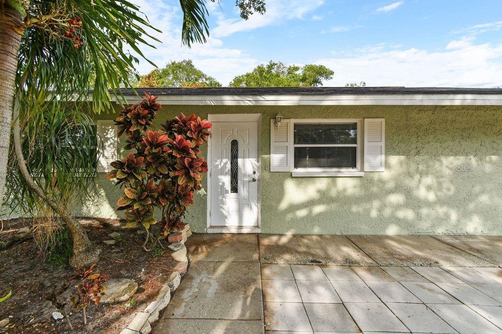 Under contract-accepting backup offers. Motivated seller! Well, Well, Well look what we have here, a gem located in Marvelous Gulfport (Non-Flood zone area)! Perfect Florida home, located a few mins away from Gulfport beach, Gulfport Casino, several restaurants and entertainment spots nearby that's facing the water! It sits off the street giving you since of privacy and peace. As you enter into this gem, you’ll notice an open floor plan along with lovely laminate flooring throughout. A unique kitchen offering all stainless-steel appliances, a built-in cooktop, granite countertops complimenting the stylish backsplash, a striking kitchen light hanging gracefully from the tray ceiling and lofty cabinets that pull out offering extensive cabinet space. The kitchen also offers bar cabinets that light up. As you continue to tour the home, you'll notice the remodeled bathroom with freshly painted walls and alluring tile complimenting the beautiful vanity with intense dept drawers that slide outwards. Bedrooms are a pleasant size for comfort and have a closet with mirror sliding doors. The third bedroom in the home comes with stylish wooden ceilings, ceramic tile flooring, large windows, a petite closet and access leading outside. This room can be used as an enclosed sunroom area, den, office space or extra storage room, your choice! There is also a laundry closet that comes with stacked washer and dryer. The dining room has sliding doors that leads out to the extraordinary, fenced in backyard, with beautifully laid pavements and trees hovering over the yard providing a great amount of shade to enjoy the Florida sunshine and its sensational breeze. This home offers peace in comfort and a sense of belonging. AirBNB restrictions 30 day minimum. Property has consistently rented for $2700/monthly bringing in cash flow. Zoned to add a pool in the backyard, Roof was installed 2019. This home has some much potential. (Motivated Seller) Schedule tour today!!