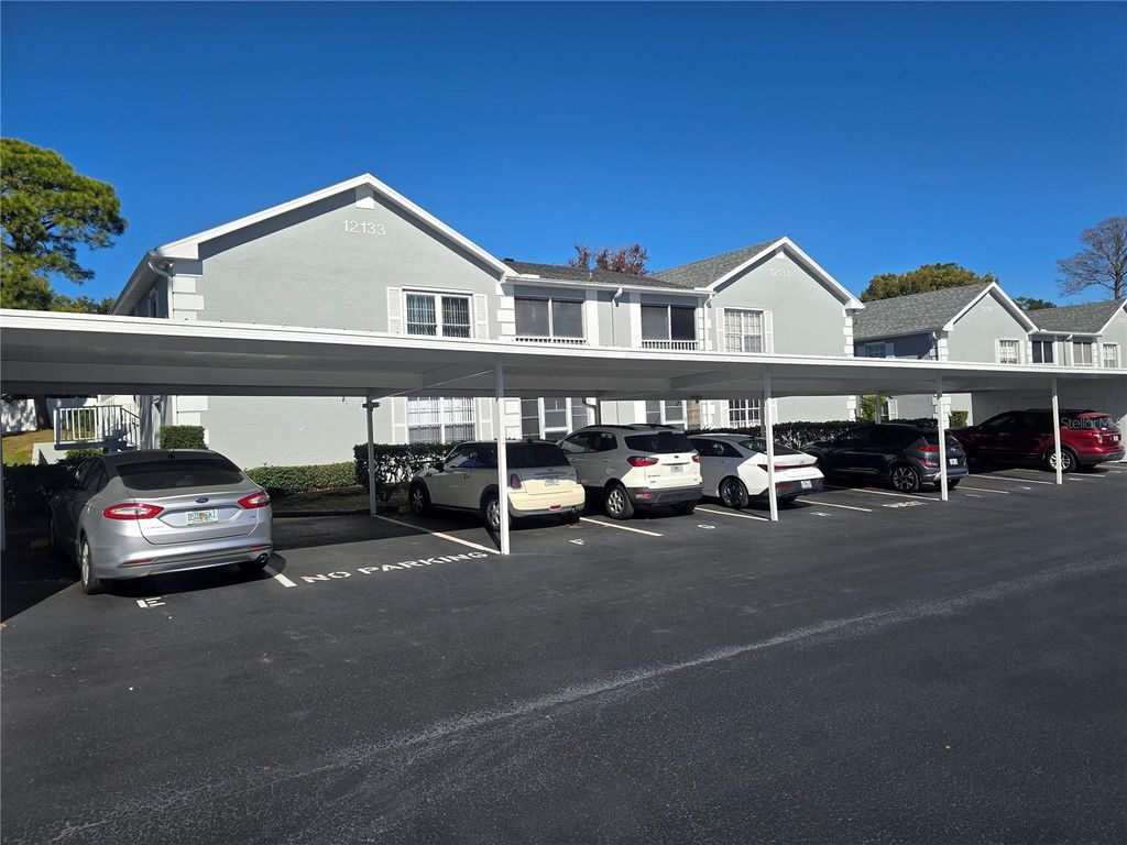 Photo of 12133 Spartan Way #102, Hudson, FL 34667 (MLS # TB8470725)