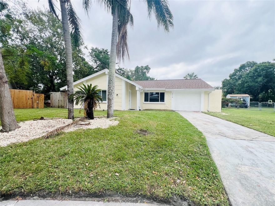 WANT A HOME READY TO MOVE IN THAT ALL MAJOR ITEMS HAVE BEEN DONE AND ALL YOU NEED IS YOUR PERSONAL TOUCHES. THIS HOME IS A 2/2/1. WHEN YOU ENTER THIS HOME IT FEELS WARM AND INVITING, WITH AN OPEN PLAN TO LIVING, DINING AND KITCHEN, THE KITCHEN HAS BEEN COMPLETLEY UPDATED, STAINLESS STEEL APPLIANCES. EVEN ROOM TO PUT AN ISLAND OR BAR. OFF LIVING ROOM ARE THE BEDROOMS WHICH ARE LARGE IN SIZE, WITH NICE SIZE CLOSETS, BOTH BATHROOMS HAVE BEEN UPDATED, OFF THE KITCHEN AND DINING AREA IS AN EXTRA ROOM THAT CAN BE A 3RD BEDROOM, OFFICE, FAMILY ROOM, PLAY ROOM.  HOME HAS A BACK SCREENED IN LANAI, A GREAT AREA FOR YOU TO SIT AND RELAX WITH A PARTIAL FENCED YARD (WHICH BELONGS TO NEIGHBORS) NICE BACK YARD ALL THIS ON A CUL DE SAC. BESIDES INTERIOR UPDATES, THE ROOF 2020, AC 2025, ELECTRICAL PANEL 2021, WATER HEATER 2021, NEW GUTTERS, THIS HOME IS CENTRALLY LOCATED TO POPULAR RESTRAUNTS, SHOPS, BEACHES, TARPON SPRINGS FAMOUS SPONGE DOCKS, PARKS, AND TAMPA AIRPORT.
