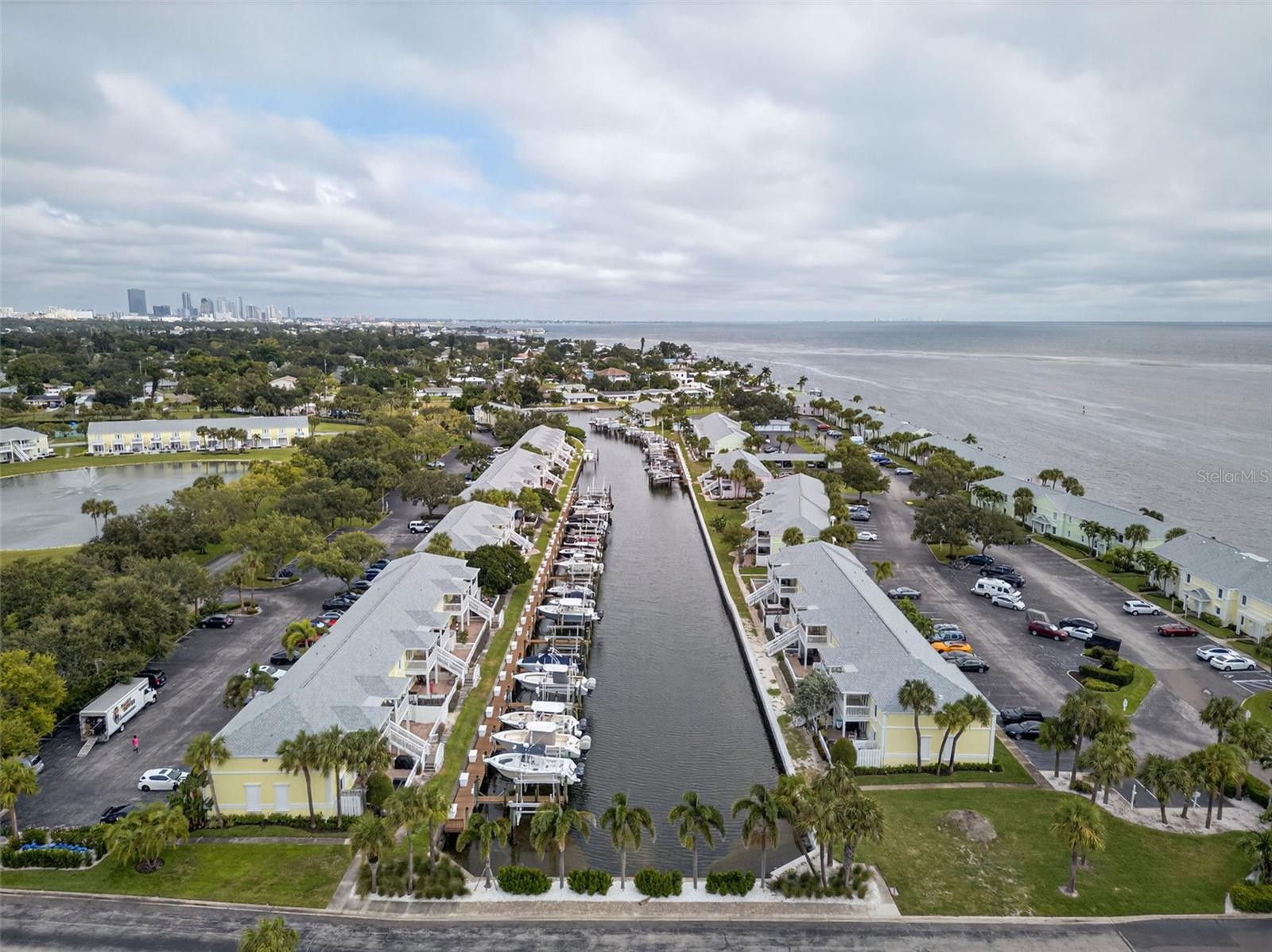 Welcome to the largest 1-bedroom condo floor plan in Waterside — an 823 sq. ft. second-floor waterfront unit with a 10K lbs BOAT LIFT, that perfectly blends comfort, style, and function. This tastefully updated condo features a bright, open layout, a modern kitchen with sleek finishes, and an updated bathroom with a beautiful walk-in shower. The spacious bedroom easily fits a king-sized bed and offers a large walk-in closet with a built-in storage system. The bonus room provides great flexibility — perfect for a home office, guest room, or additional closet space. Enjoy peace of mind with hurricane-impact windows and a new electrical panel.
A true boater’s paradise — this condo includes a 10,000-lb boat lift (installed in 2019) located directly behind the unit, offering quick and easy access to open water. With the boat lift included, this property delivers incredible value that’s hard to find anywhere else.
Enjoy pickleball courts, sand volleyball, a dog park, and a waterfront Yacht Club with regular social events. Your monthly HOA covers nearly everything — water, sewer, trash, cable, internet, and exterior maintenance — leaving only your electric bill to handle separately. Whether you’re relaxing on your balcony, watching dolphins play, or heading out for a sunset cruise, this is the perfect place to experience the true Florida lifestyle.