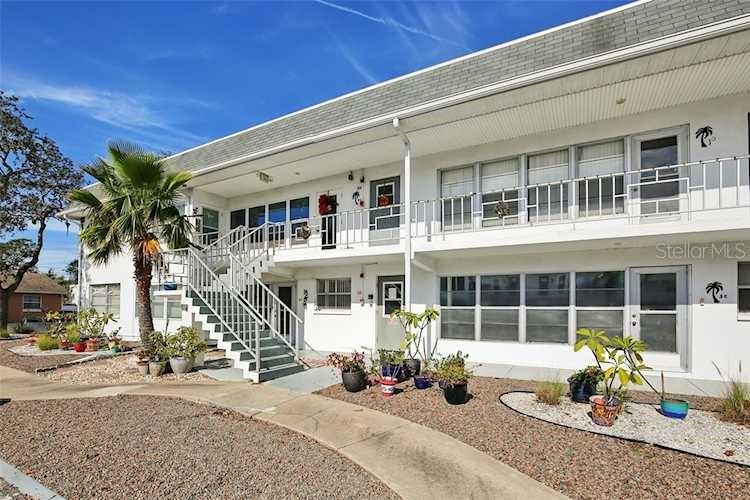 Welcome to Drew Ridge! This quaint 55+ coop community is near the heart of Clearwater, FL, and all the city has to offer! Just a 9 minute drive to world-famous Clearwater Beach! And this condo is NOT in a flood zone! This one-bedroom unit is extremely spacious, with the Florida room professionally enclosed to the main living room (unlike some units, this is one is a beautiful open living space). The entire unit was recently renovated with new quartz countertops, resurfaced bathroom tile, lights, paint. The bedroom has plenty of storage space, with a lengthy built-in closet, plus an additional utility closet. Out back is a lovely patio area, perfect for enjoying our beautiful weather. This condo is being sold FURNISHED and is really stunning once you see it in person. It has a great location in the community, right next to the laundry room, and close to one of the side exits of the complex. It comes with one designated parking space (located directly in front of the unit), but there are additional visitor spots available as well. Absolutely beautiful, you won't be disappointed!