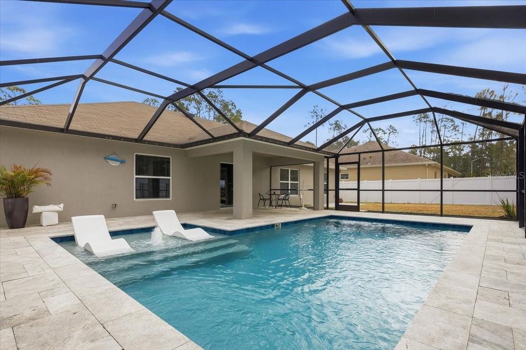 Photo of 10 Poinfield Place, Palm Coast, FL 32164 (MLS # FC316052)