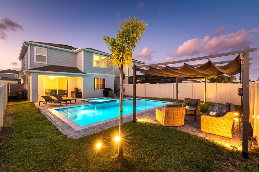 Are you looking for a newer, optionally furnished 5-bedroom home with an amazing backyard and saltwater pool oasis that fits your budget? This next-gen house has it all - newer construction, a bedroom and full bath on the main level, a bright and airy kitchen with a center island that overlooks the living and dining room with views of the fenced backyard and remote-controlled pool with cabana and spa. Why buy a home without a pool and have to add a $100k+ pool to it when you can purchase this one for less? Imagine leaving the Disney Parks just 20 minutes away and turning on your spa to have it ready for you once you get home! Seller will consider selling the furniture as well. You will love the amount of natural sunlight that comes into this home and all the thoughtful details throughout. There's even a custom-built drop zone on the main level near the garage entry for added convenience. A spacious loft on the second story allows for an exciting gaming space or relaxing library. You'll also enjoy the inviting primary bedroom with views of the pool and a primary bath that features a large walk-in closet. Neighbors love this community and all of its amenities which include a Community Clubhouse with a state-of-the-art Fitness Center and resort-style Pool and Playground. You will love having a private, gated entry with a resident-only kayak launch for recreation and fishing right on Hancock Lake. The Serenoa Lakes community is in Clermont and tucked immediately beside Horizon West giving you the best of all that Clermont has to offer while putting you only minutes from Walt Disney World and the surrounding areas. Schedule your tour of this home today!