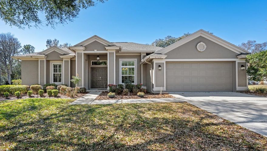 Step into this meticulously upgraded 3-bedroom, 2-bathroom gem located in the prestigious Silverthorn community, where modern luxury meets effortless convenience. Fully transformed in 2021, this home shines with fresh interior and exterior paint, luxury vinyl flooring, and elegant plantation shutters throughout. The heart of the home is a stunningly remodeled kitchen and coffee bar, boasting a magnificent granite island, granite countertops, an IKTCH range hood, a noiseless Profile dishwasher, a brand-new mini-bar, and custom cabinetry with smart pull-outs and soft-close features. Entertain in the spacious dining room or relax in the living area by the sleek 2022 Amantii electric fireplace. No detail has been spared, from the high-quality and energy-efficient thermal windows and 2021 HVAC (under warranty through 2030) to the smart home integration featuring a Wi-Fi thermostat and garage door opener. Both bathrooms have been fully remodeled; the primary suite features a sculptural freestanding soaking tub and a sleek, curbless walk-in shower with a dedicated vent heater, while the guest bath offers premium tile flooring, a modern walk-in shower, and a built-in nightlight. Outside, enjoy the privacy of the lanai with its 2025 retractable solar shade, new remote-controlled fans, and a Jenn-Air electric grill station for family events. Complete with a new irrigation well pump, a 2019 roof, a 2-car plus 1-golf-cart garage with epoxy floors, and ample attic storage, this turnkey gem—even including three 55-inch Vizio TVs—is ready for you to move in and enjoy! The Silverthorn community offers a range of amenities, including pickleball, tennis courts, a gym/fitness center, and a community center with activities; a library, community pool, playground, barbecue area, and basketball court; and a restaurant, pro shop, and pay-to-play golf. This home is in a prime location close to the Suncoast Parkway for a quick commute to Tampa, less than 7.5 miles from famous attractions like the mermaids at Weeki Wachee Springs, Anderson Snow Park, and Veterans Memorial Park, and just minutes away from major medical facilities, shopping, fine dining, and much more!