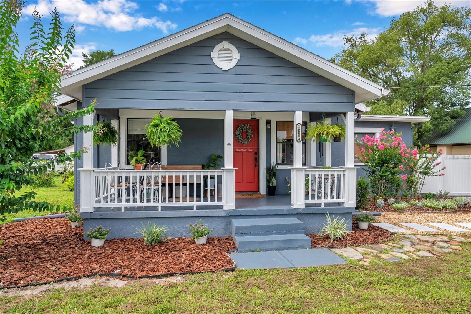 YOUR COUNTRY ESCAPE AWAITS: CRAFTSMAN HOME ON HALF AN ACRE
Way out on a quiet little street where life slows down and neighbors wave hello, this warm and welcoming Craftsman home is just waiting for someone to settle in and make it their own. Sitting pretty on over half an acre, this 3-bedroom, 2-bath gem—with a bonus room that could serve as a home office or additional bedroom—has that cozy, homey feeling the moment you step inside. If you’ve been dreaming about starting a little homestead, growing your own food, or just having space to breathe—with NO HOA and NO FLOOD ZONE to worry about—this might just be the one.
Inside, you’ll find charm throughout—crown molding, a newly renovated custom kitchen, beautifully updated bathrooms, and spacious rooms designed for everyday living and effortless entertaining. Generously sized bedrooms offer large walk-in closets, with the primary bedroom featuring an en suite bath and the front bedroom offering pocket door access to the hall bath. A versatile bonus room provides the flexibility to create a home office, guest room, or cozy den. A new hot water heater adds peace of mind, and with no carpet anywhere in the home, upkeep is as easy as pie.
Enjoy peaceful mornings or relaxed evenings on the two covered porches—front and back—each offering inviting outdoor space perfect for sipping sweet tea or catching up with friends. The exterior is equally impressive, featuring a newly installed septic system, new well pump tank, fully fenced yard, and an outdoor shower for rinsing off after a hard day’s work in the garden—or a swim in that future pool you’ve been hankerin’ for. A large concrete pad is ideal for rollerblading, scooters, basketball, or even parking an RV or boat. The expansive grassy backyard has plenty of room for a pool or a small homestead setup—chickens, goats, and gardens all welcome. A separate fenced side yard makes the perfect space for pets or raised beds. You’ll also find 12 blooming Crepe Myrtle trees, a citrus-producing tree, a large fire pit perfect for storytelling under the stars, and a short walk to the nearby community park.
Other highlights include an attached garage, indoor laundry with washer and dryer, rain gutters, and vinyl fencing. With no HOA and located in a non-flood zone, this property offers both freedom and flexibility. Plus, it’s just five minutes to the Suncoast Parkway for an easy commute anywhere in Tampa.
Surrounded by great neighbors and offering character you can’t find in a cookie-cutter home, this property appeals to families, homesteaders, and anyone seeking charm, space, and privacy—without sacrificing convenience. Comfortable, welcoming, and move-in ready, this home feels like a warm embrace on a cool country night. Whether you're looking for a primary residence, a weekend escape, or a long-term investment, this special retreat is ready to be yours.