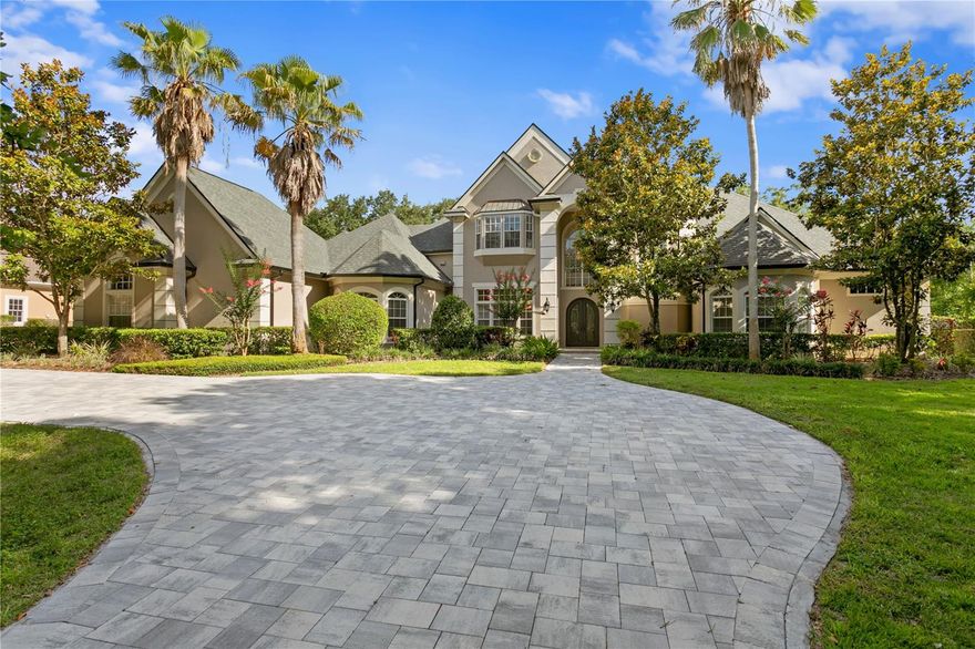 Absolutely beautiful home in Avila, Tampa Bay’s premiere guard-gated, golf and country club community. The setting and curb appeal of this home is spectacular. The home is enhanced with beautiful landscaping, gorgeous front entry doors, a new roof in 2021 and a new pavered driveway that welcomes you and your guests. This gorgeous home features 6,404 Sq Ft of air-conditioned living space, including 2 Downstairs Master Suites, 4 additional bedrooms, 6 full and 2 Half bathrooms, Game Room, a 4 Car Garage and a Swimming Pool and Spa. As you step inside, the cathedral ceiling and ample windows bathe the home in natural light, creating a warm and inviting atmosphere. The formal living room beckons you to entertain, with a built-in bar and additional bar counter seating. The gourmet kitchen is a chef's dream, boasting professional-grade appliances, including a 6 burner gas range, double ovens and a warming drawer. The kitchen's beautiful cabinetry, granite countertops and cozy dining space make it the heart of the home, flowing seamlessly into the family room. The open floor plan makes entertaining a breeze, with the adjoining game room serving as the perfect gathering place for friends and family complete with an additional built-in wet bar and bar counter seating. The first level is complete with 2 beautiful master retreats, each boasting spa-like master bathrooms and custom closets. An additional bedroom, perfect for a home office, is also found on this level. Upstairs, 3 additional bedrooms await, with one bedroom featuring an ensuite bathroom and the other two sharing a Jack and Jill Bathroom. The outdoor living areas are equally breathtaking, with a new screen enclosure expanding which expands your living space to enjoy the Florida sunshine. Living in Avila means enjoying the utmost security, privacy, and a lifestyle tailored to perfection within this exceptional community. Welcome home to Avila, where you can indulge in the finest amenities and experience the epitome of luxury living.