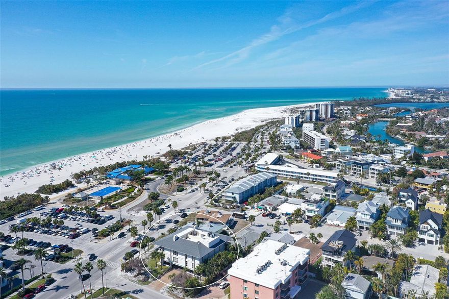 Embrace the best of coastal living in this maintenance free home.  This rarely available 3-bedroom condo is just steps from stunning Lido Beach! Welcome to Lido Pointe, an exclusive four-unit complex offering just two residences per floor. Known for its solid construction and pride of ownership, this boutique building provides a secure and private coastal retreat just across the street from the pristine shores of Lido Beach.  Fully renovated in (2019) this sun filled condo exudes modern elegance with an open-concept design perfect for stylish entertaining. The chef’s kitchen boasts abundant cabinetry, a spacious island, a breakfast bar, quartz counters, and a pantry. The dining area flows seamlessly into the living room, featuring high ceilings and a cozy family room with built-ins and a fireplace. From here, enjoy breathtaking views of the Gulf of Mexico, crystal-clear aqua blue waters, and Sarasota’s world-famous sunsets. The primary suite is a tranquil retreat with a walk-in closet and a spa-like en suite bath. Two additional bedrooms share a beautifully updated second bath. Designed with a coastal-chic aesthetic, this home captures the essence of relaxed luxury. Additional building/community highlights include: two covered garage spaces, two shared storage units, and secure elevator access that is code compliant.  Newer roof, soffits, chimney replacement, and upcoming lush landscaping offer peace of mind for years to come.  Live your best beachside lifestyle! Cross the street to Lido Beach or take a short stroll to St. Armands Circle for premier shopping and dining. Downtown Sarasota and Sarasota International Airport are just minutes away. This property checks all the boxes, convenience, privacy, and Sarasota charm.