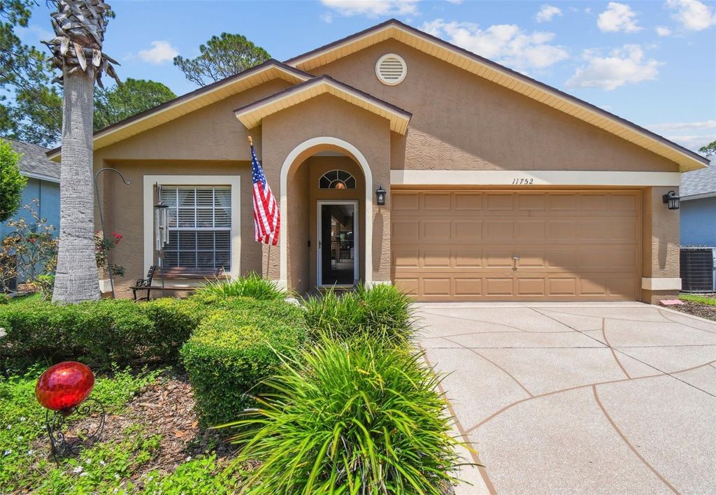 Photo of 11752 Wheatfield Loop, Hudson, FL 34667 (MLS # W7875725)