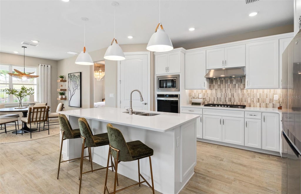 Photo of 2656 Blowing Breeze Ave, Kissimmee, FL 34744 (MLS # O6440307)