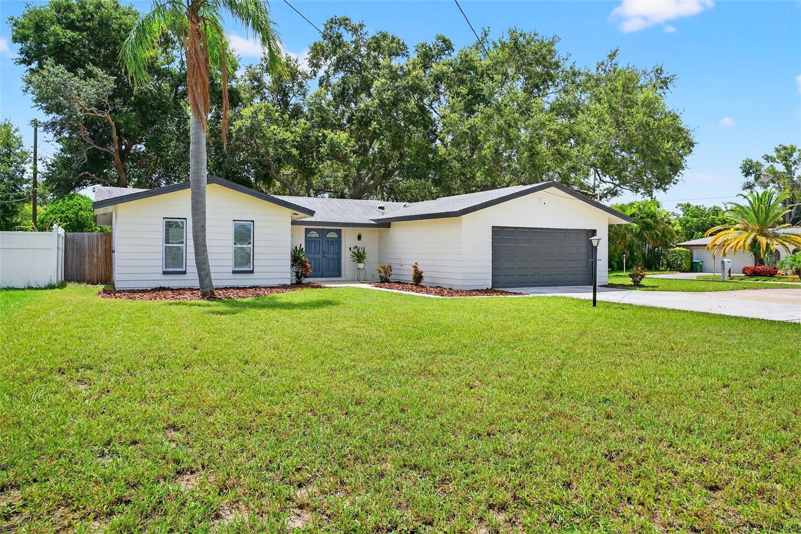 Ready to move in! This 3-bedroom, 2-bath home includes a 2-car garage and versatile office/den. Open floor plan connects living, dining, and kitchen for a seamless layout. Located on a corner lot with a fully fenced yard and two patios great for entertaining or relaxing. Renovated throughout with real wood trim, crown molding, IKEA soft-close cabinets, stainless steel appliances, and granite countertops. Hurricane-rated windows, sliders, and garage door. New roof, AC, furnace, duct work, and insulation. Turnkey property just unpack.