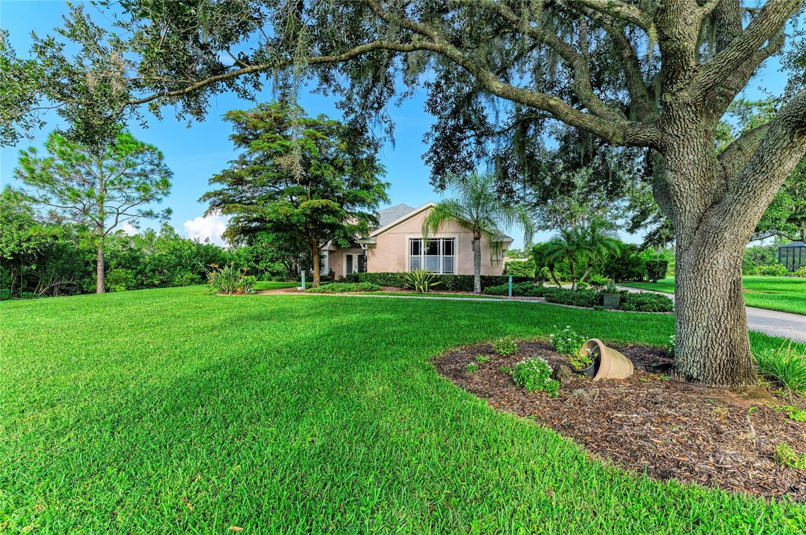 Preserve at Panther Ridge – This beautifully updated home sits on over an acre of lush, mature landscaping, offering exceptional privacy and a spacious backyard retreat. Elegant glass double doors open to a bright formal dining room with a large picture window and graceful archway. The expansive great room features sliding glass doors to the lanai, creating a seamless flow between indoor and outdoor living.
The newly renovated kitchen is a chef’s dream, complete with a designer hood, custom cabinetry, upgraded granite countertops, and a striking backsplash. A cozy café-style dining nook overlooks the serene backyard.
The primary suite is a private sanctuary with large windows, sliders to the lanai, and two walk-in closets—plus a third closet in the remodeled spa-like bath, featuring a walk-in shower and soaking garden tub. Two additional bedrooms share an updated bath, while a fourth bedroom boasts its own private entrance through a third full bath, ideal for guests or multigenerational living.
Upgrades abound, including new flooring, a brand-new roof, and enhanced finishes throughout. Outside, enjoy a large lap pool, fully equipped outdoor kitchen, tranquil koi pond, and an air-conditioned workshop—all with views of a pristine nature preserve.
The Preserve at Panther Ridge offers an active lifestyle with scenic walking trails, parks, a playground, basketball courts, and tennis courts. Perfectly located near Waterside, Lakewood Ranch Main Street, and UTC Mall, with quick access to shopping, dining, and entertainment.