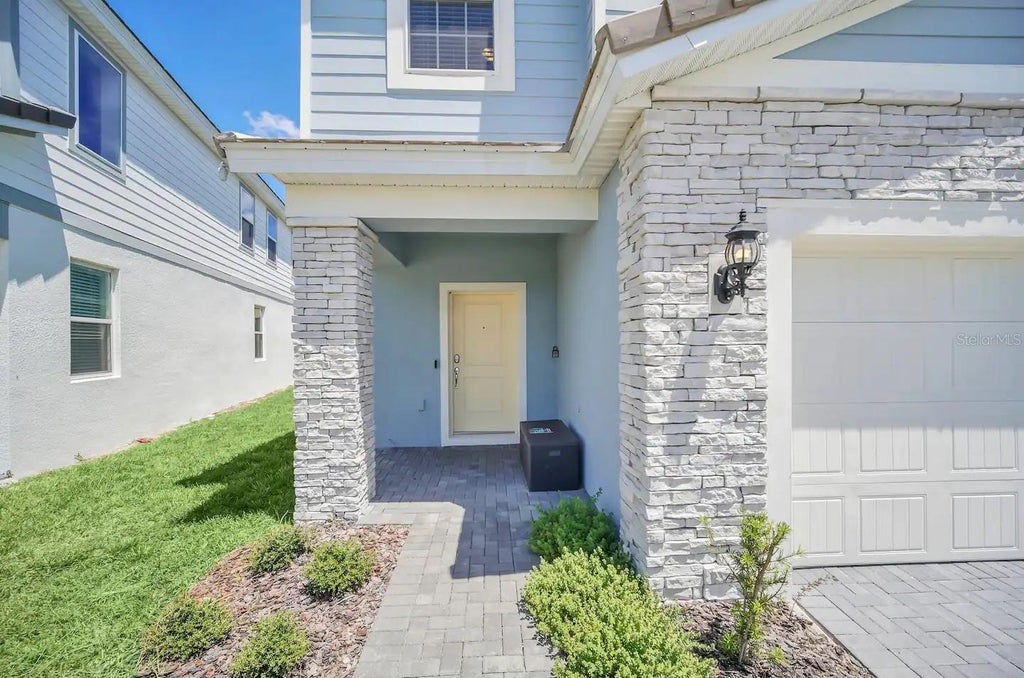 Photo of 7263 Oakmoss Loop, Davenport, FL 33837 (MLS # O6446304)