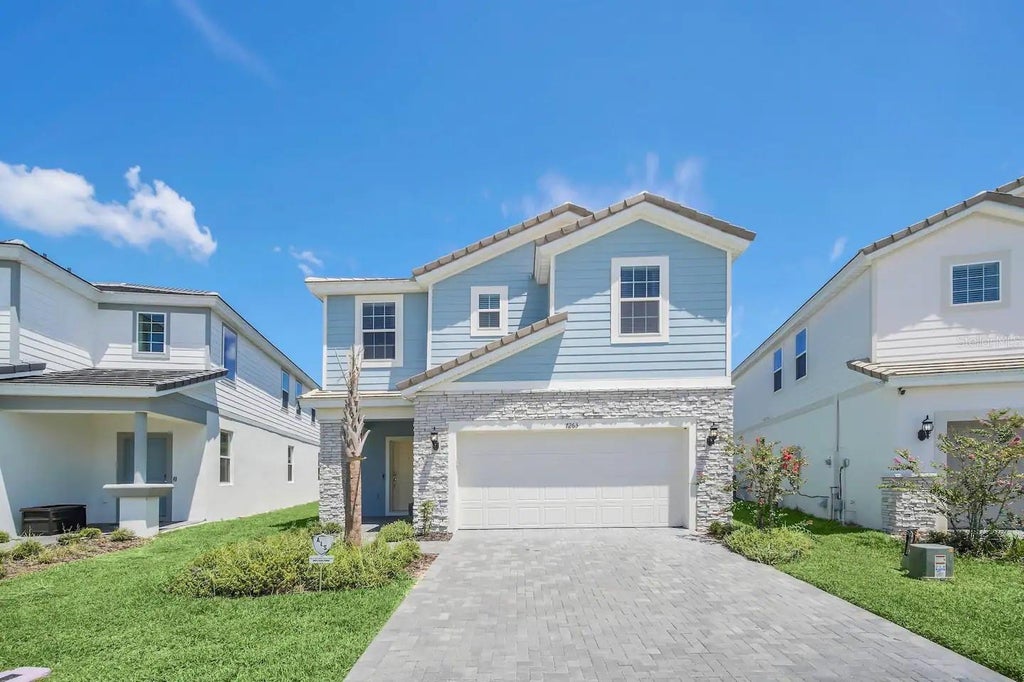 Photo of 7263 Oakmoss Loop, Davenport, FL 33837 (MLS # O6446304)
