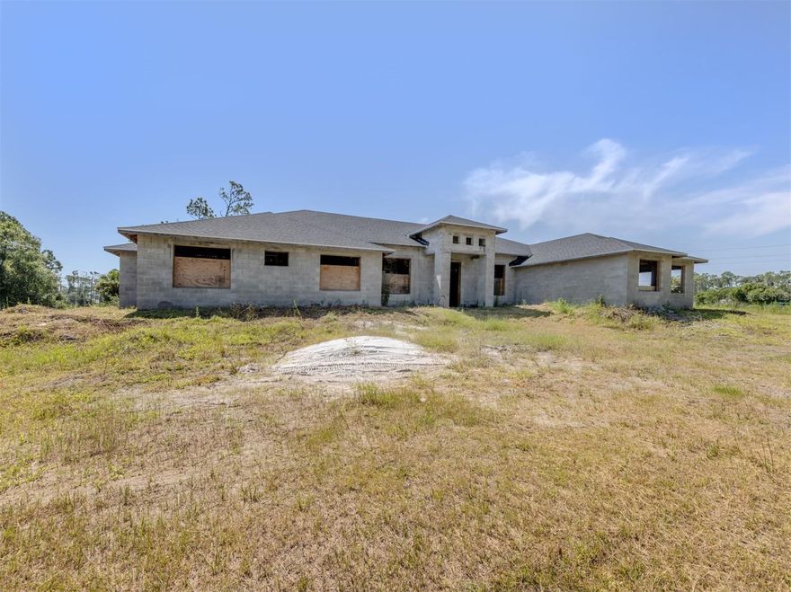 Under Construction. Investor, Builder & Homesteader Opportunity! Unlock the potential of this rare multi-dwelling property in the heart of booming North Port! Sitting on 2.25 acres (with an additional 2 acres available on a separate contract for a total of 4.25 acres), this unique offering features two homes ready for your finishing touch. The main home spans 3,137 sq. ft. under air with 5 bedrooms, 4 bathrooms, and a 3-car garage. The secondary home offers 899 sq. ft. under air, featuring 2 bedrooms, 2 bathrooms, and a 1-car garage—perfect for multi-generational living, rental income, or a guest retreat. While the seller will not complete construction, blueprints and drawings are included so you can bring your own vision to life. City water is paid for and available (not yet connected), and the multifamily zoning opens the door to a variety of possibilities—private estate, income-producing property, or investment development. Whether you’re an investor seeking strong ROI potential, a builder looking for your next project, or a homesteader dreaming of space and flexibility, this property offers endless opportunity in the desirable fast-growing area of North Port